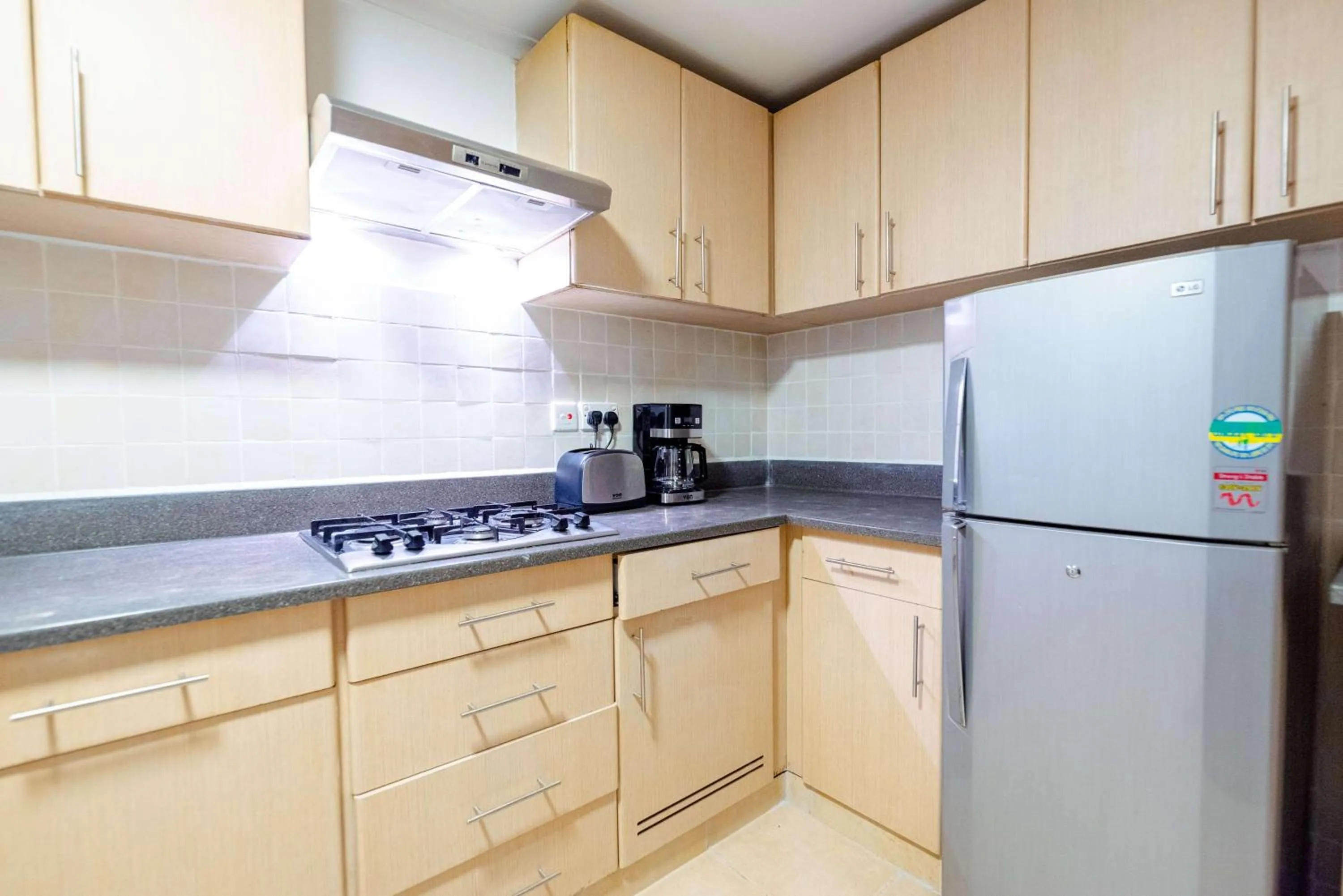 Kitchen or kitchenette in Heri Heights Hotel Apartments, SureStay Collection by Best Western