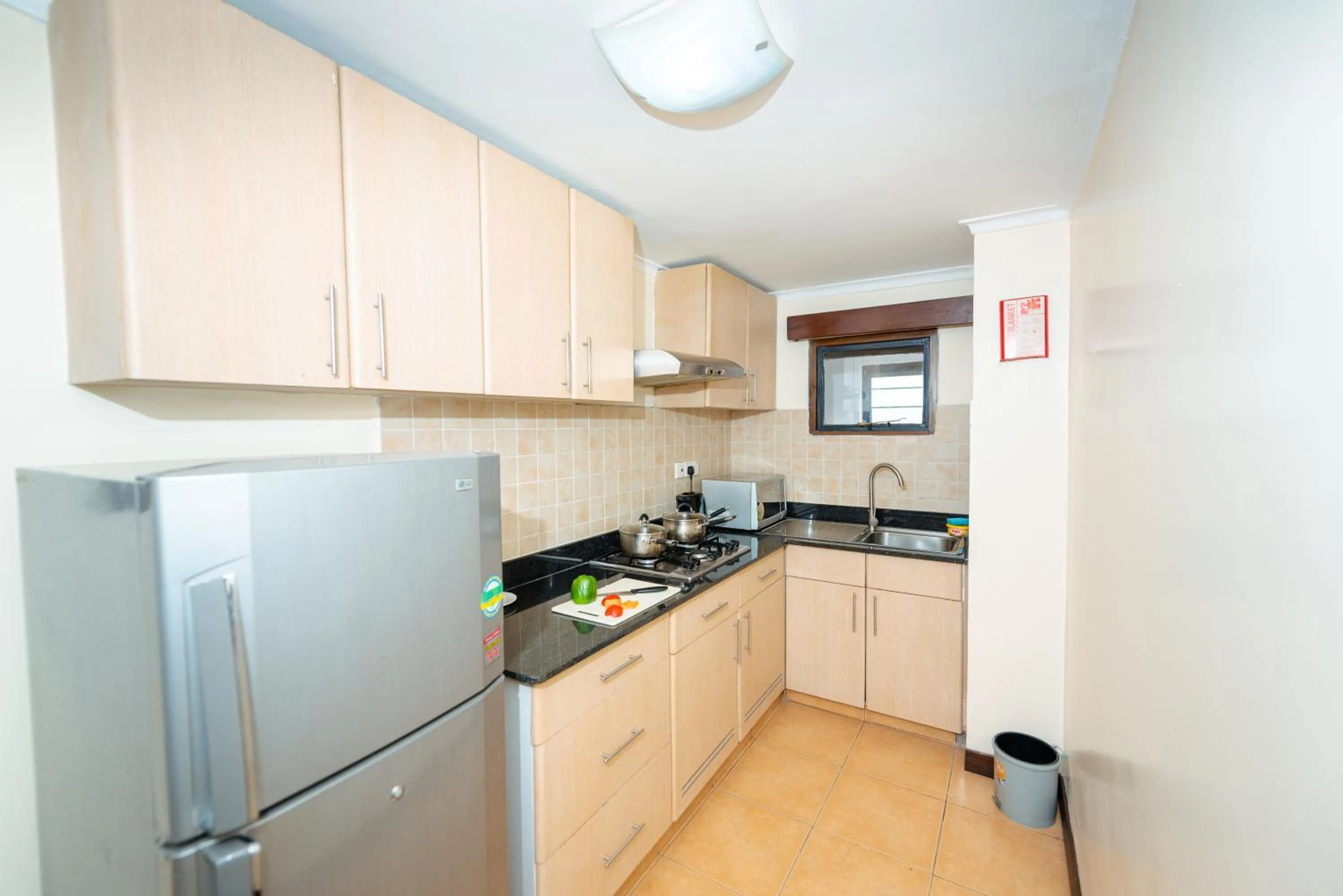 Kitchen or kitchenette in Heri Heights Hotel Apartments, SureStay Collection by Best Western