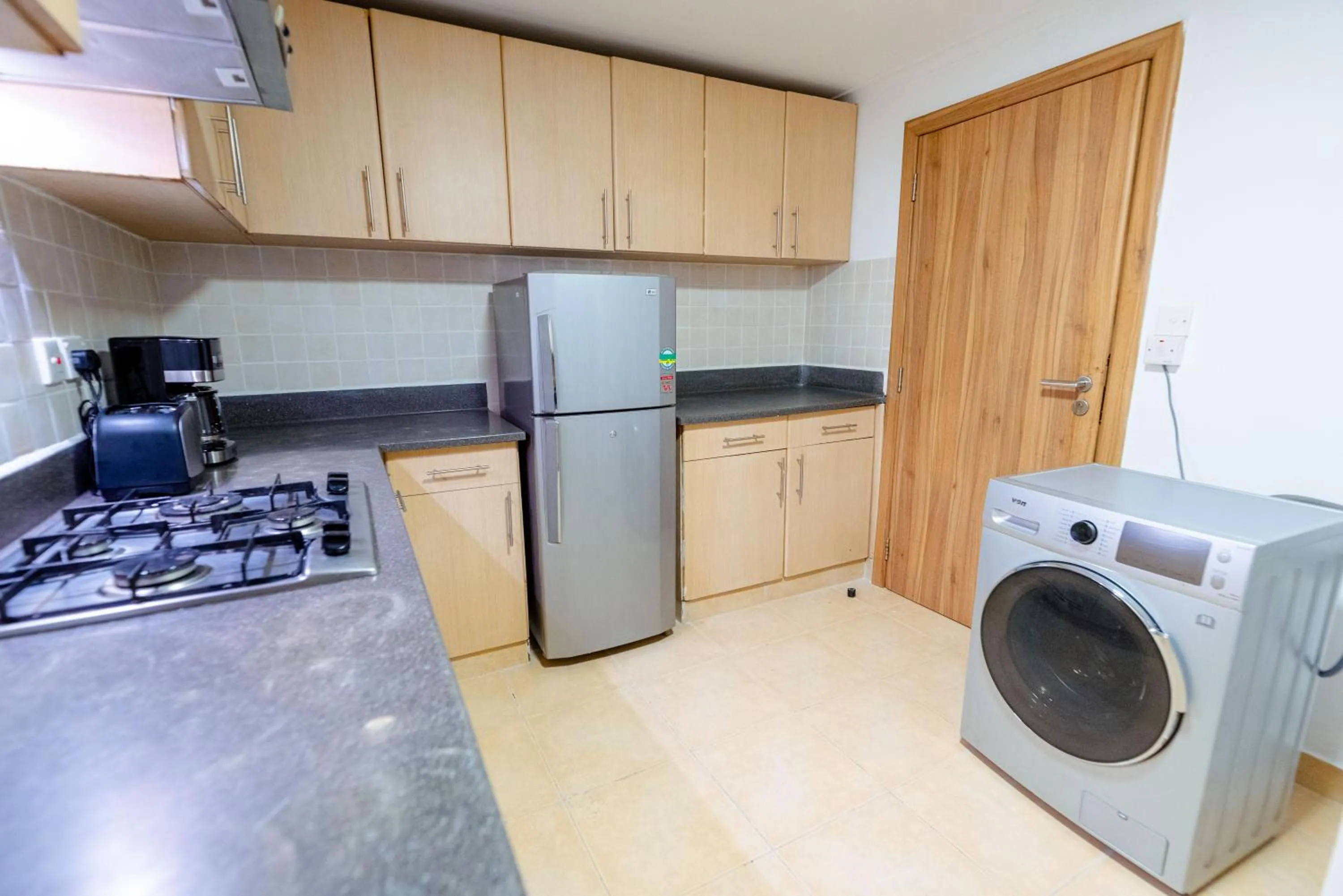 Kitchen or kitchenette in Heri Heights Hotel Apartments, SureStay Collection by Best Western