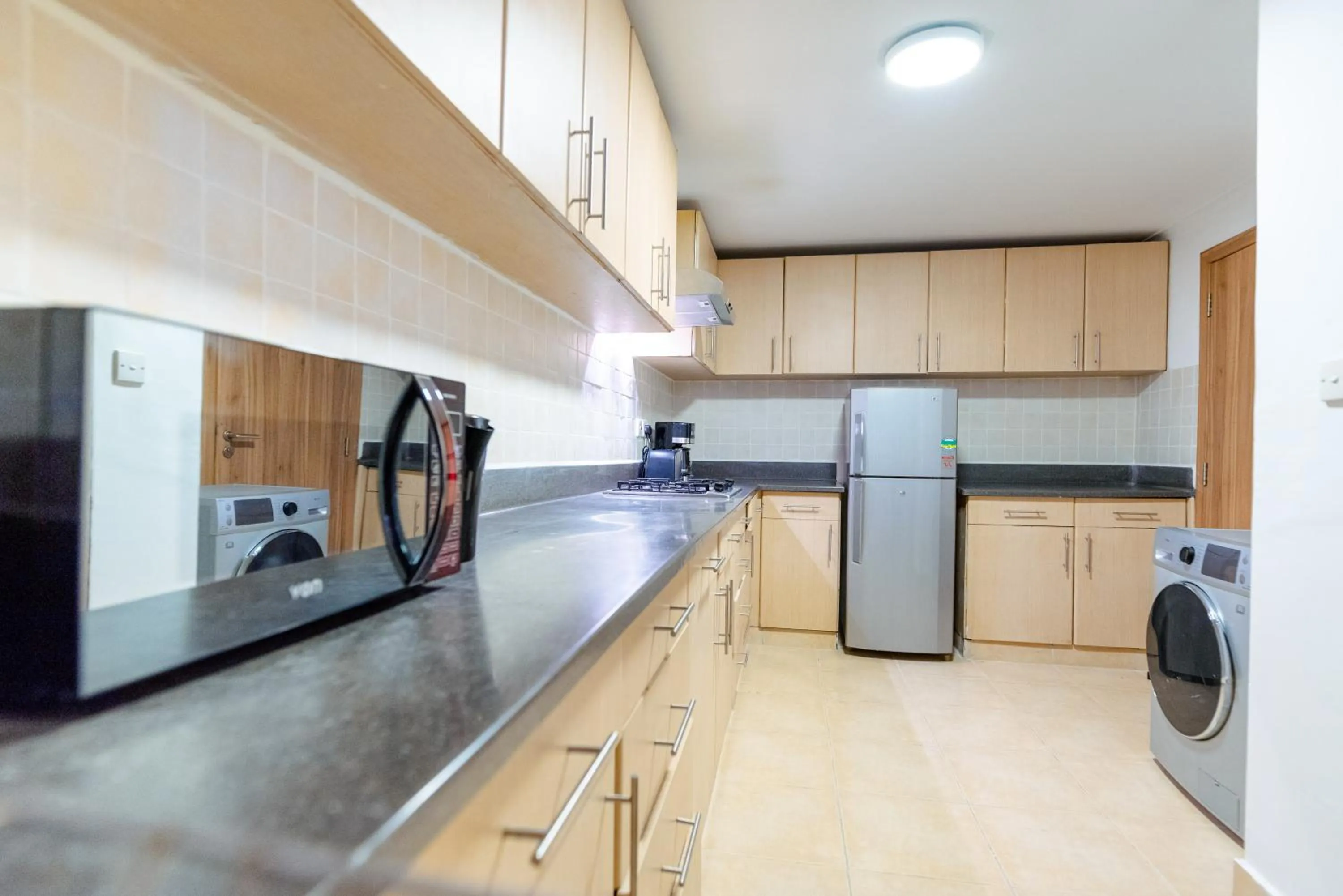 Kitchen or kitchenette in Heri Heights Hotel Apartments, SureStay Collection by Best Western