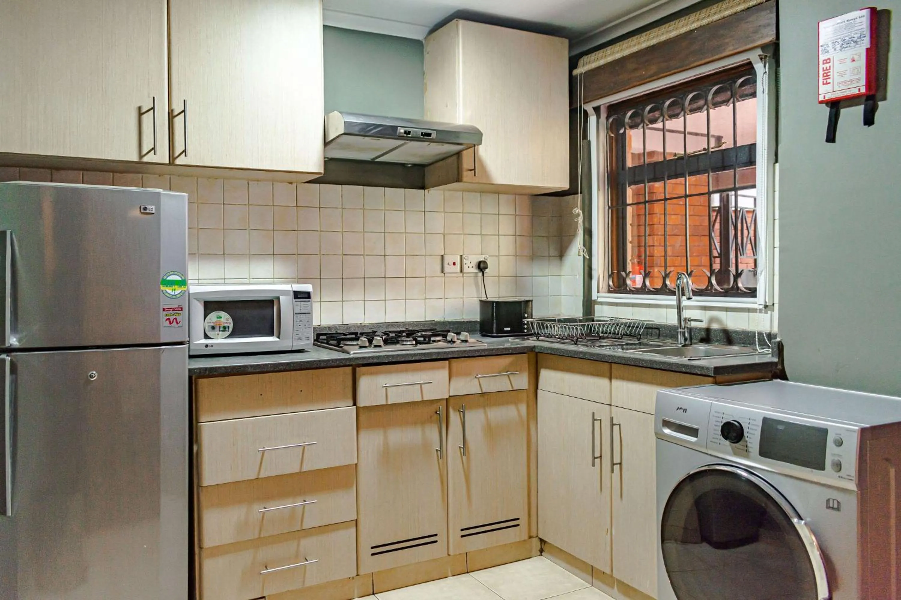 Kitchen or kitchenette in Heri Heights Hotel Apartments, SureStay Collection by Best Western