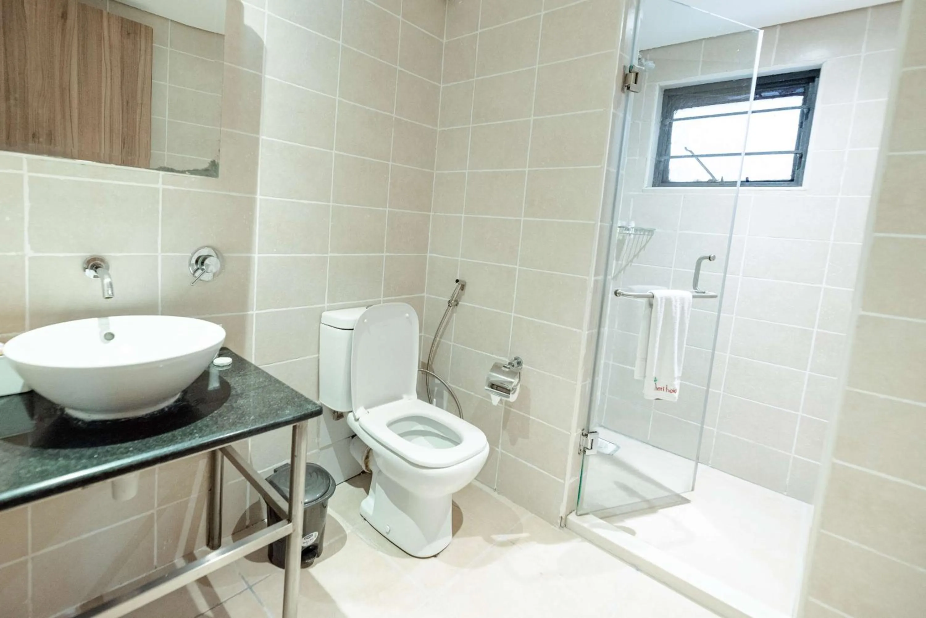 Bathroom in Heri Heights Hotel Apartments, SureStay Collection by Best Western