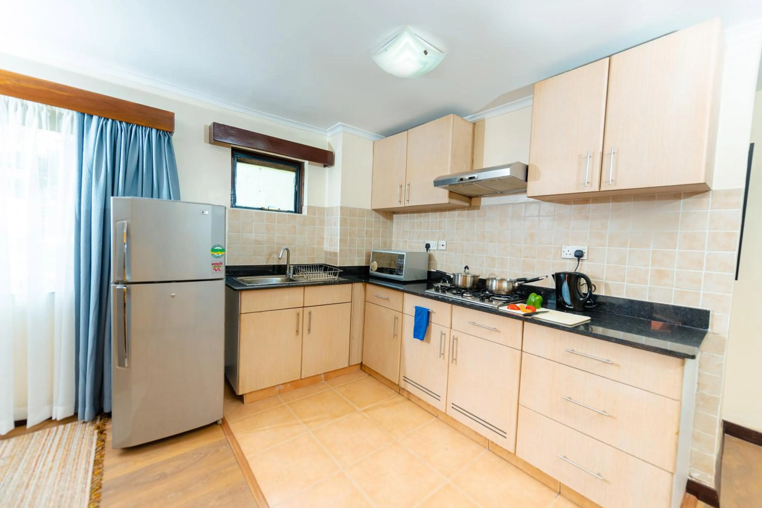 Kitchen or kitchenette in Heri Heights Hotel Apartments, SureStay Collection by Best Western
