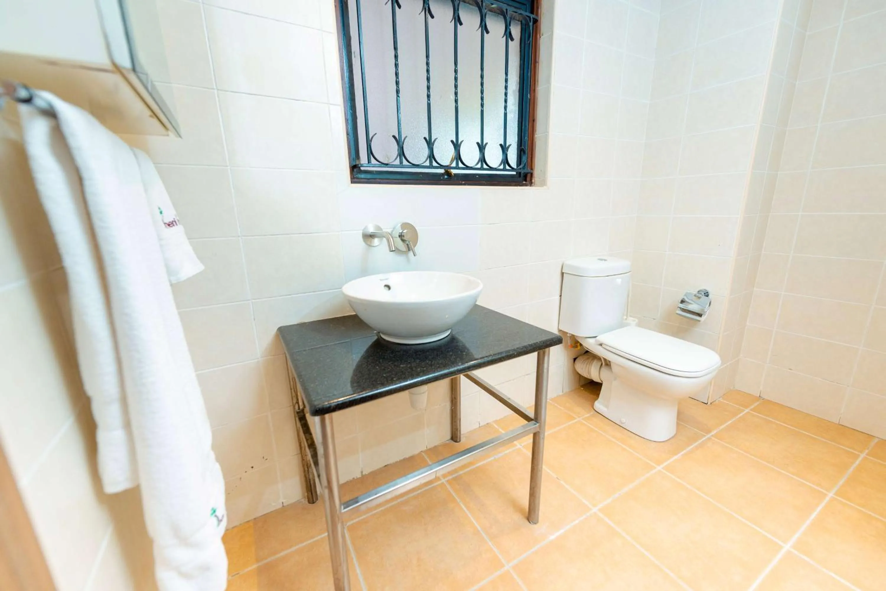 Bathroom in Heri Heights Hotel Apartments, SureStay Collection by Best Western