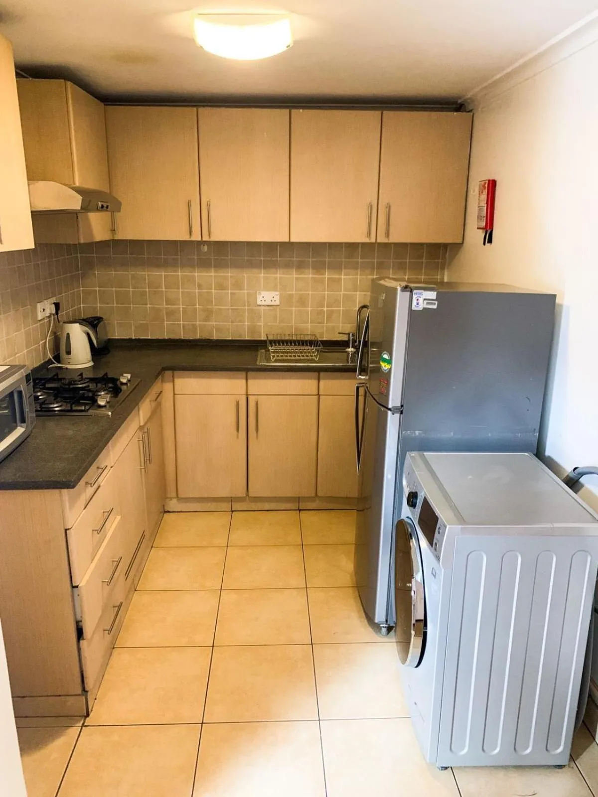 Kitchen or kitchenette in Heri Heights Hotel Apartments, SureStay Collection by Best Western