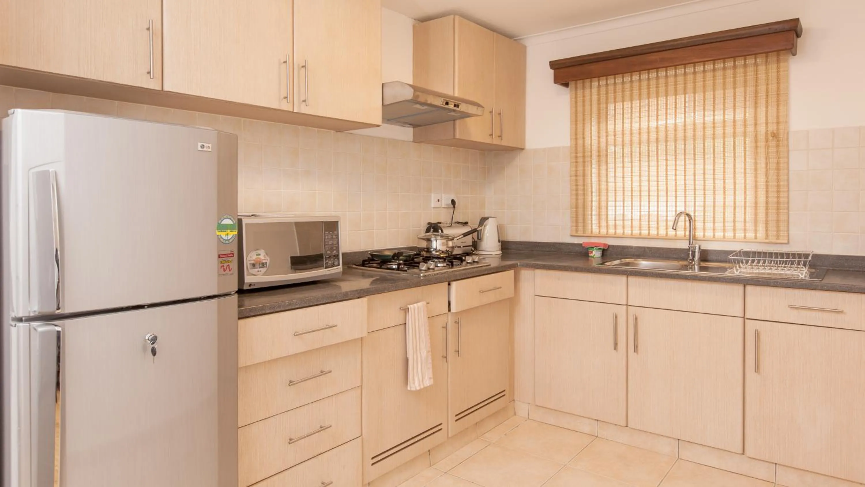 Kitchen or kitchenette in Heri Heights Hotel Apartments, SureStay Collection by Best Western