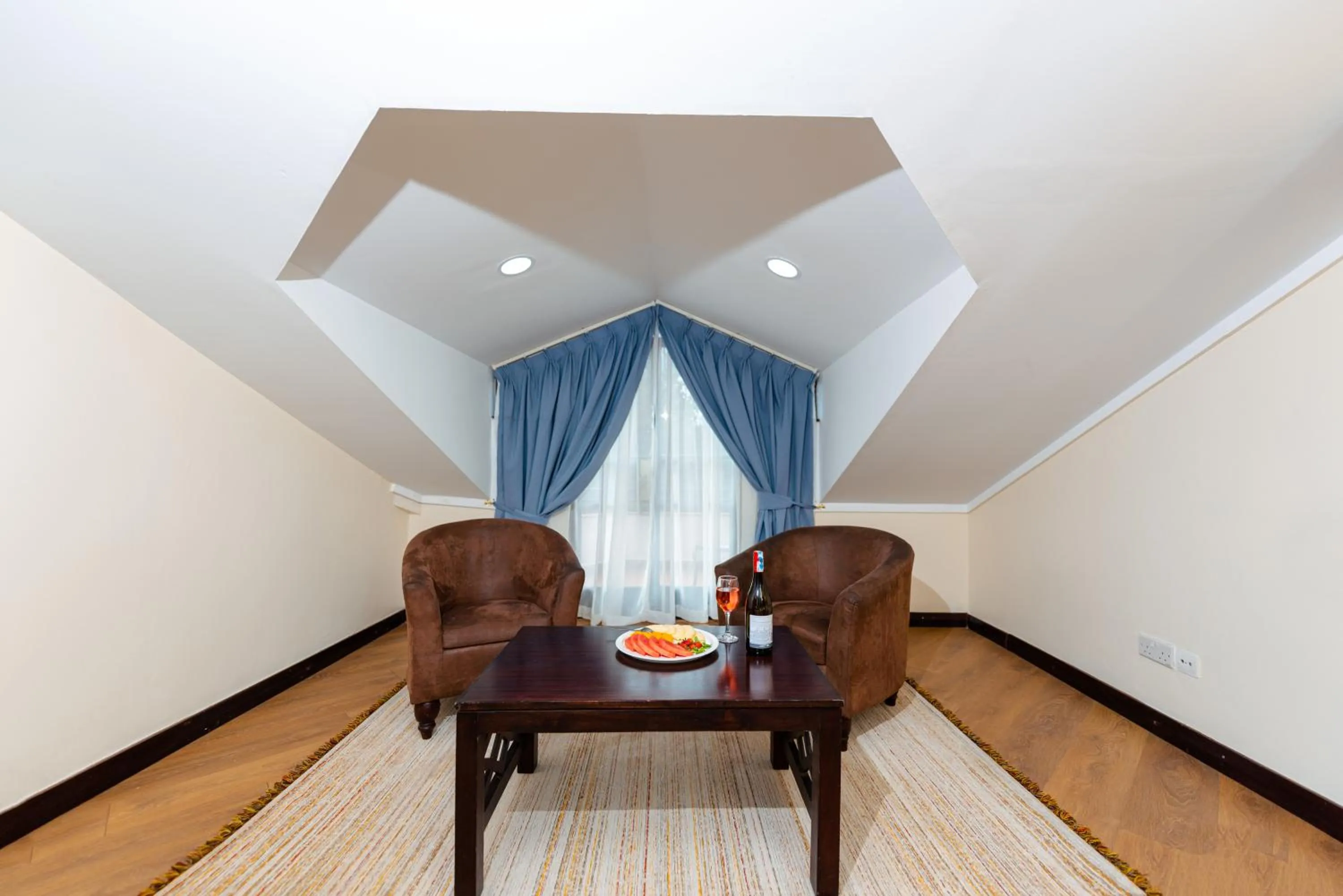 Living room in Heri Heights Hotel Apartments, SureStay Collection by Best Western