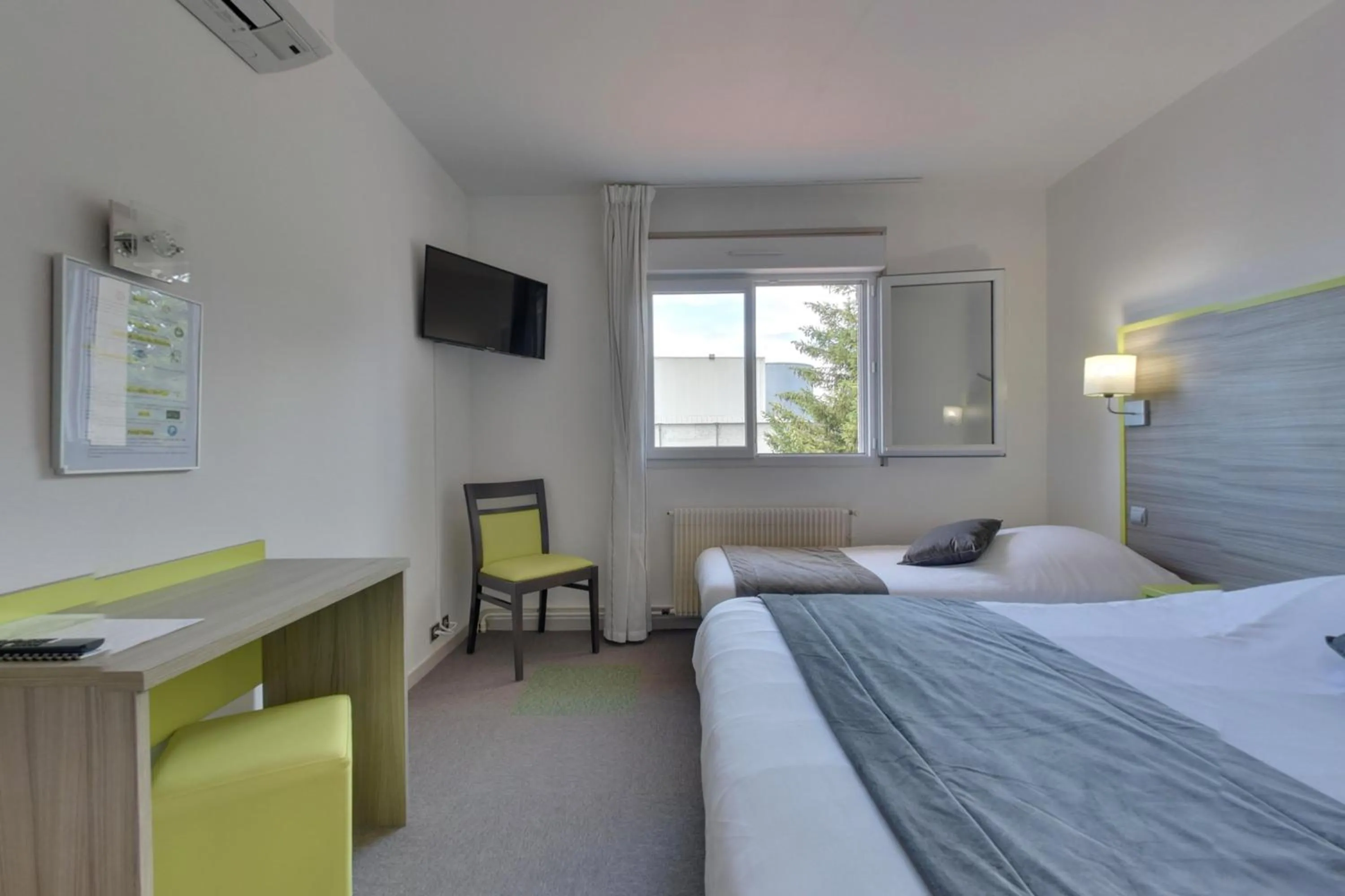 Photo of the whole room, Bed in Contact Hôtel O'Nice Saintes