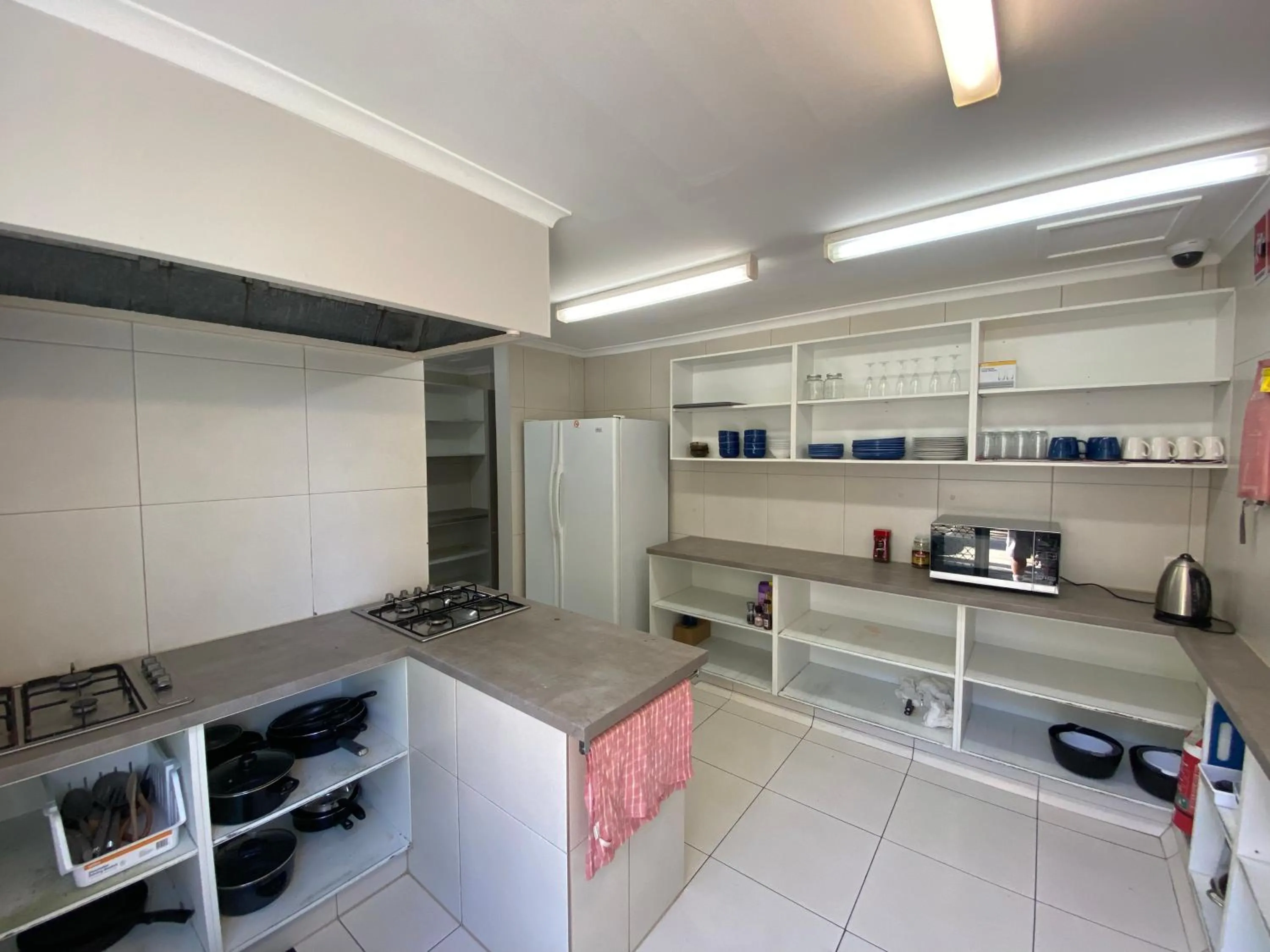 Communal kitchen in Homely Inn Hostel
