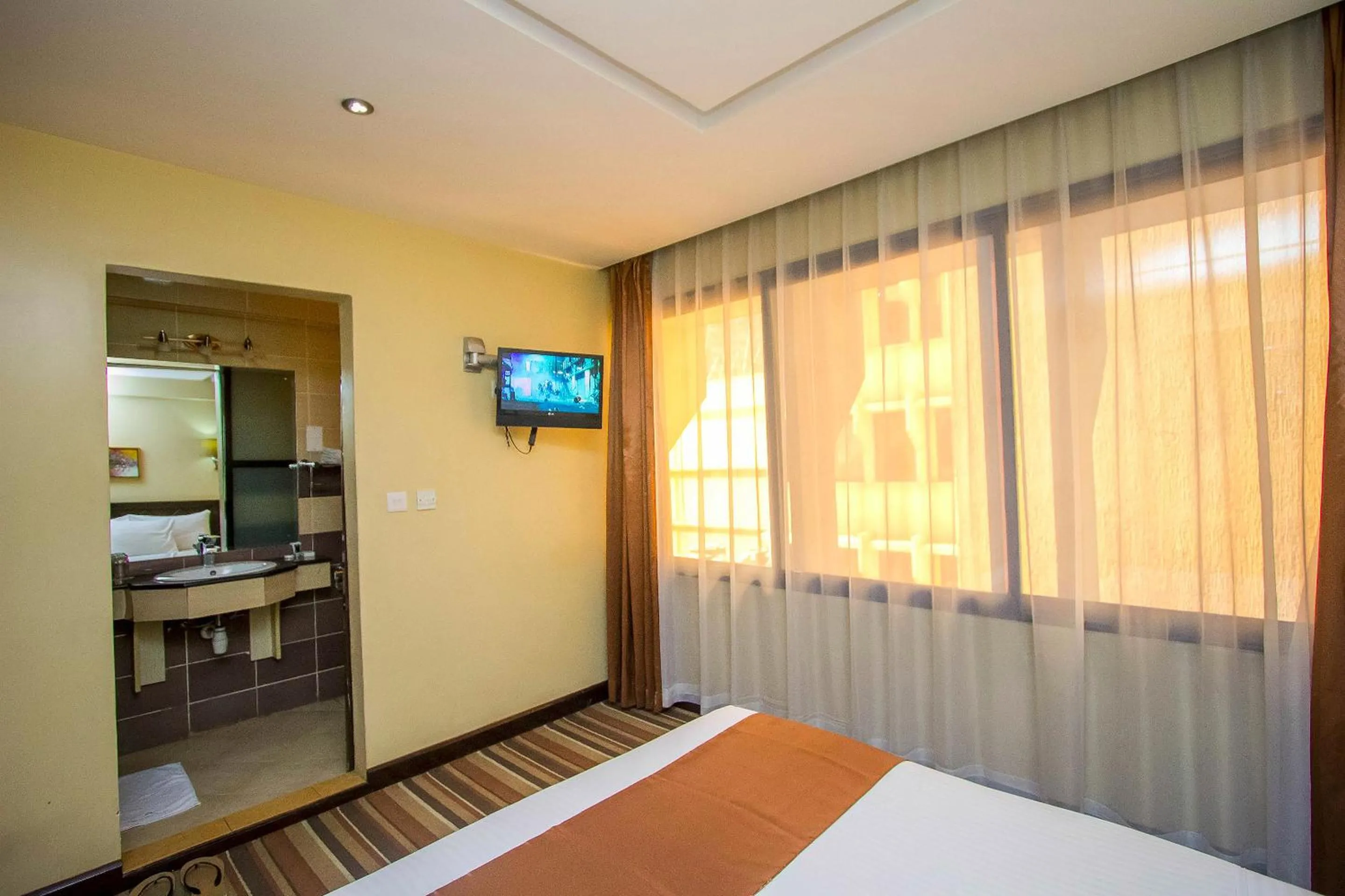 Bed in The Clarion Hotel