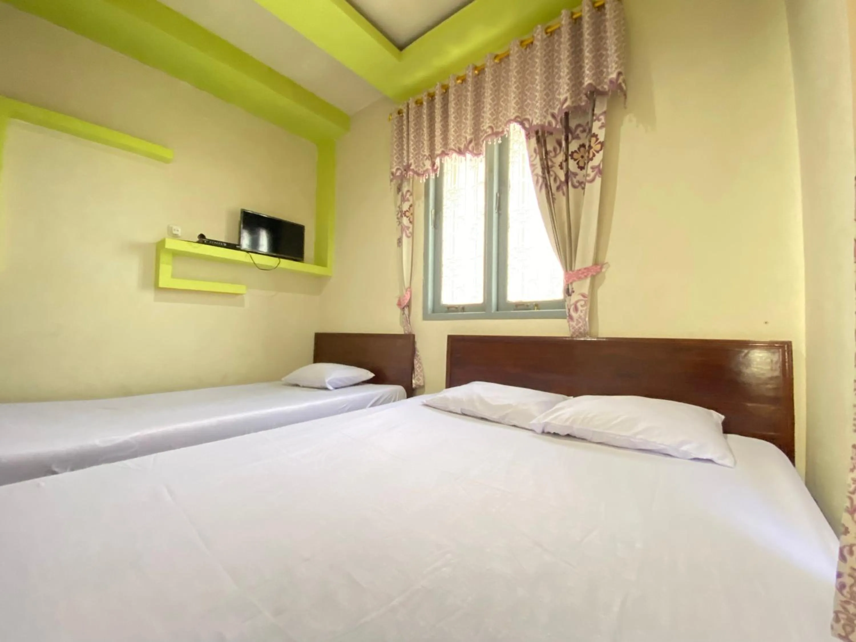 Bed in Homestay Srikandi Syariah Dieng RedPartner