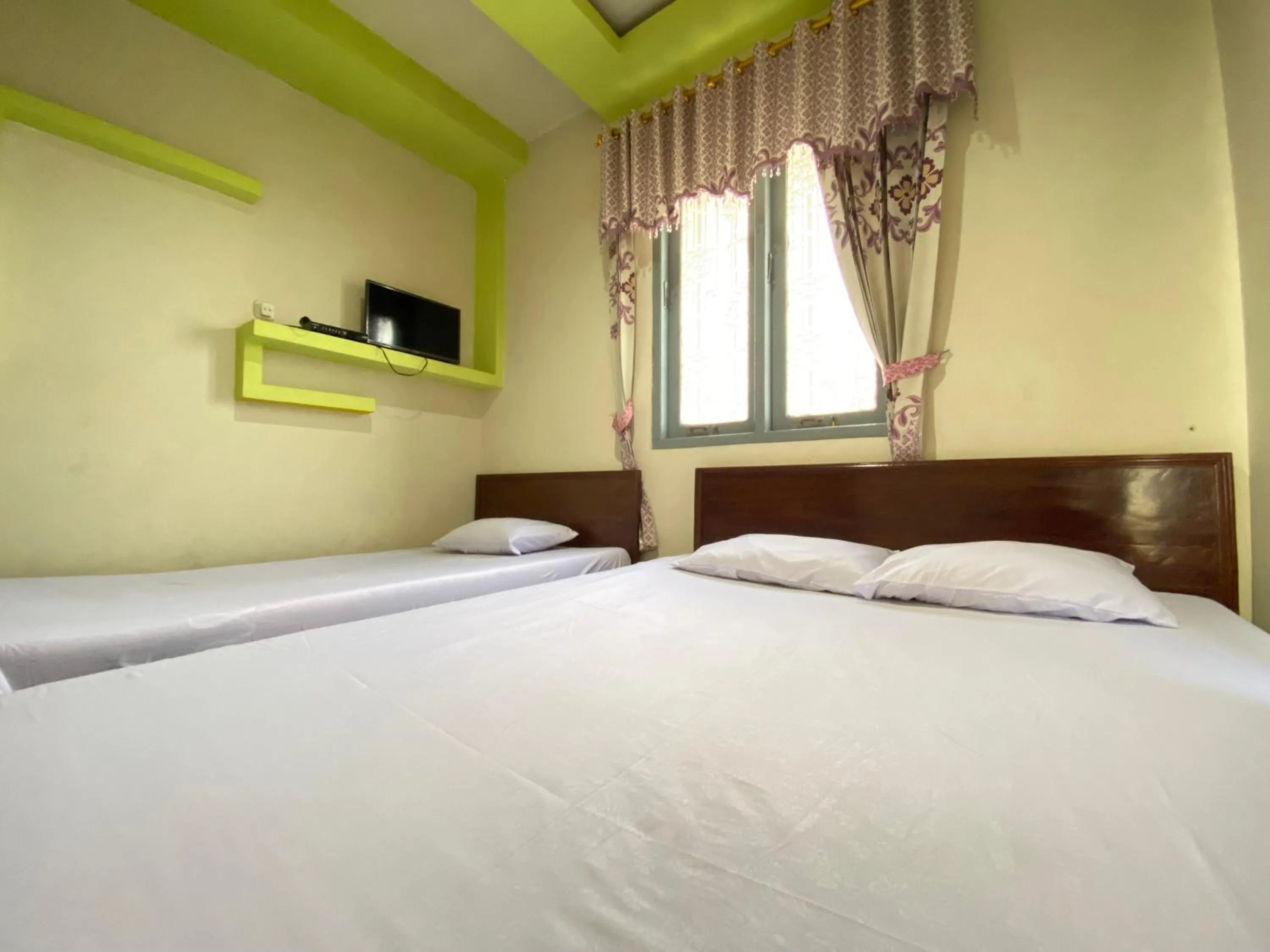 Bed in Homestay Srikandi Syariah Dieng RedPartner