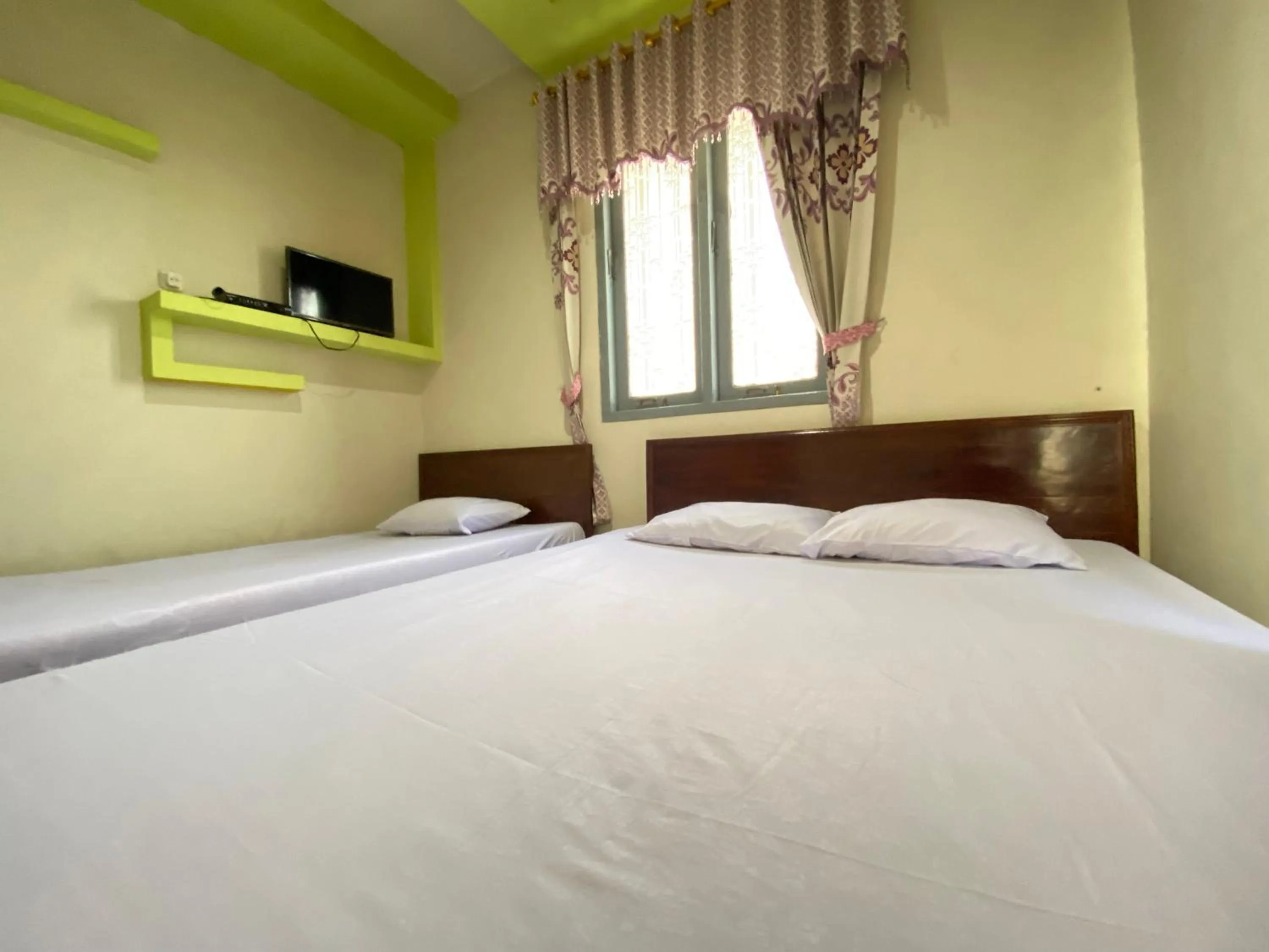 Bed in Homestay Srikandi Syariah Dieng RedPartner