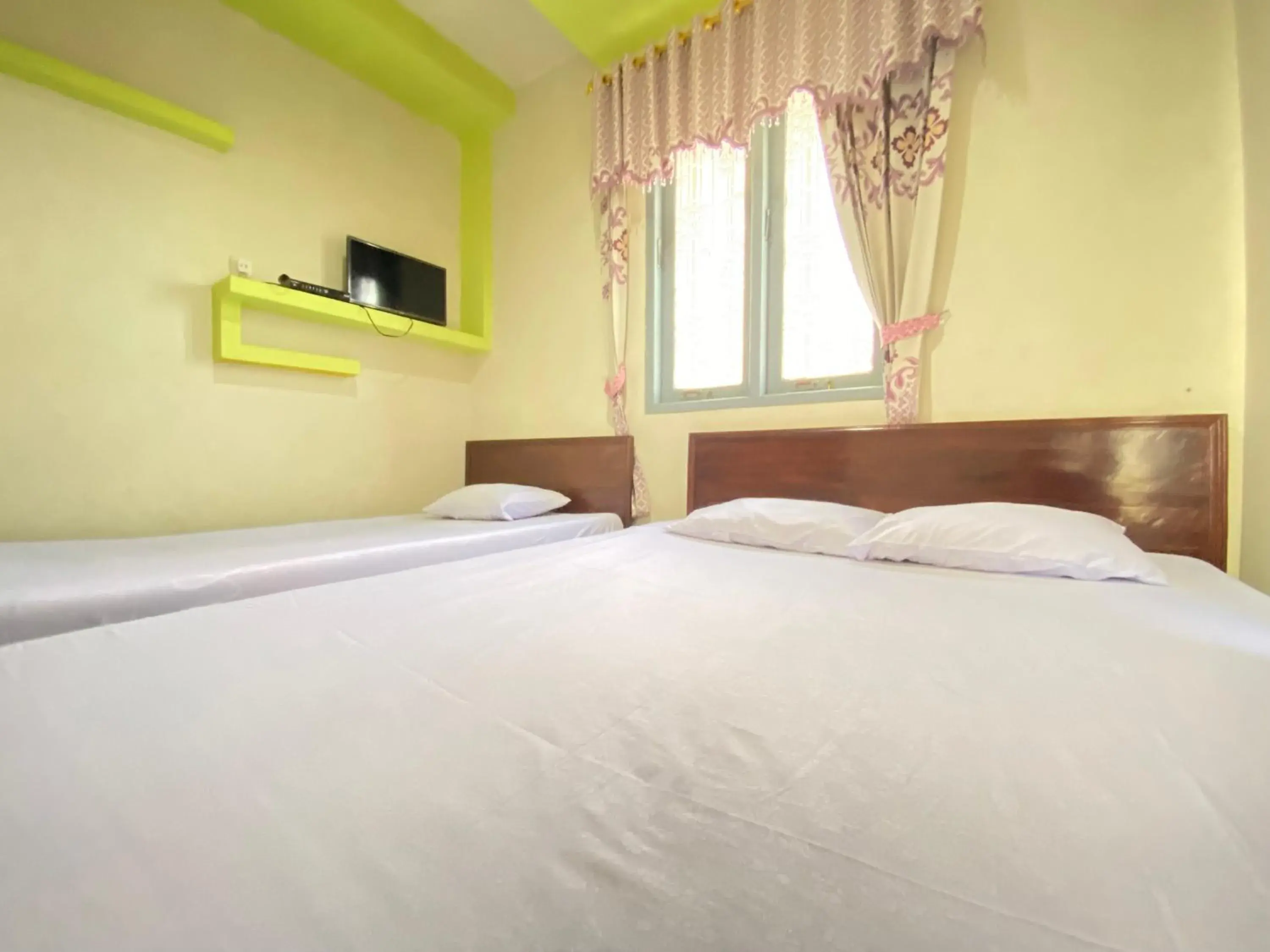 Bed in Homestay Srikandi Syariah Dieng RedPartner Bed in Homestay Srikandi Syariah Dieng RedPartner