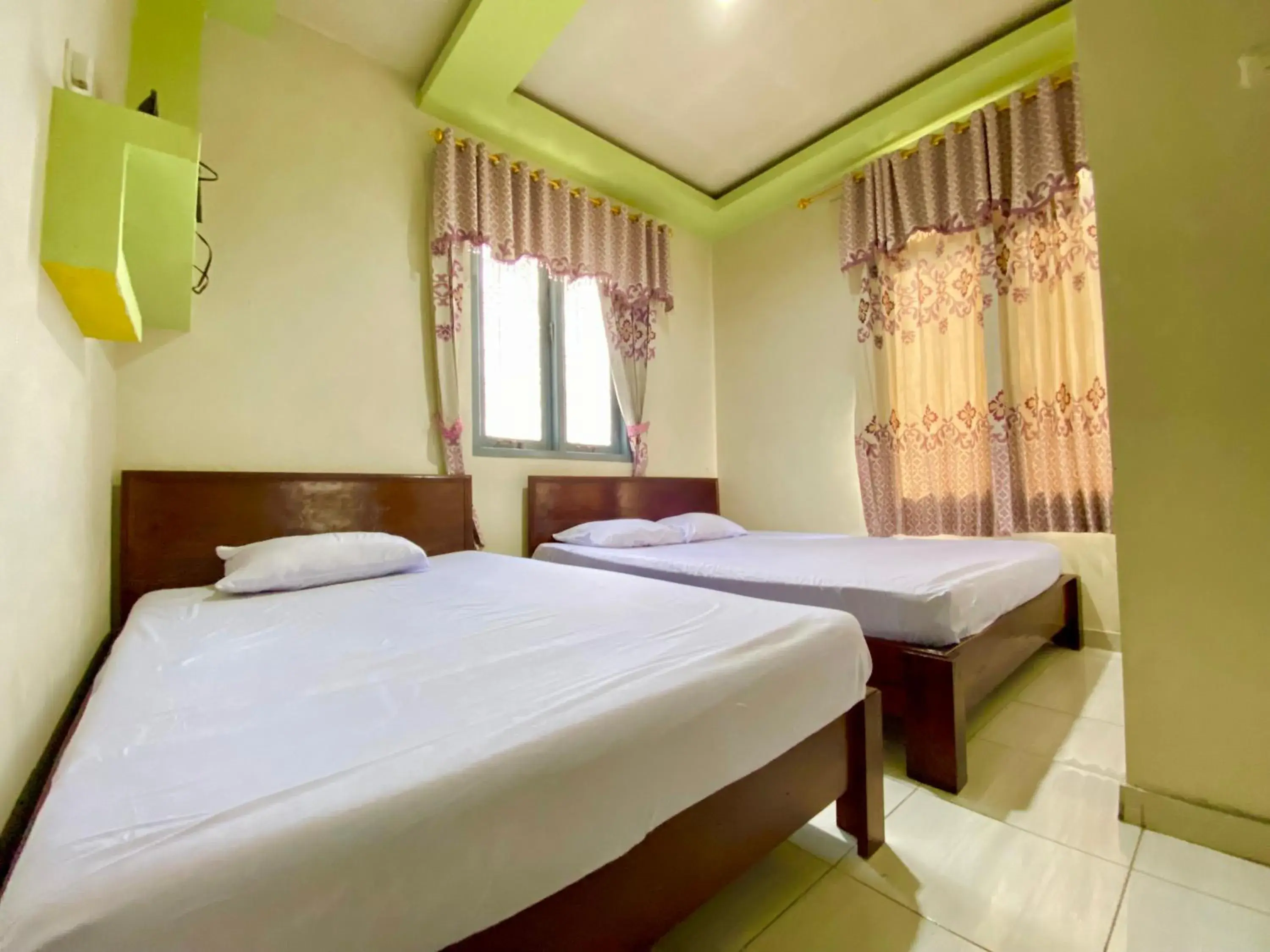 Bed in Homestay Srikandi Syariah Dieng RedPartner Bed in Homestay Srikandi Syariah Dieng RedPartner