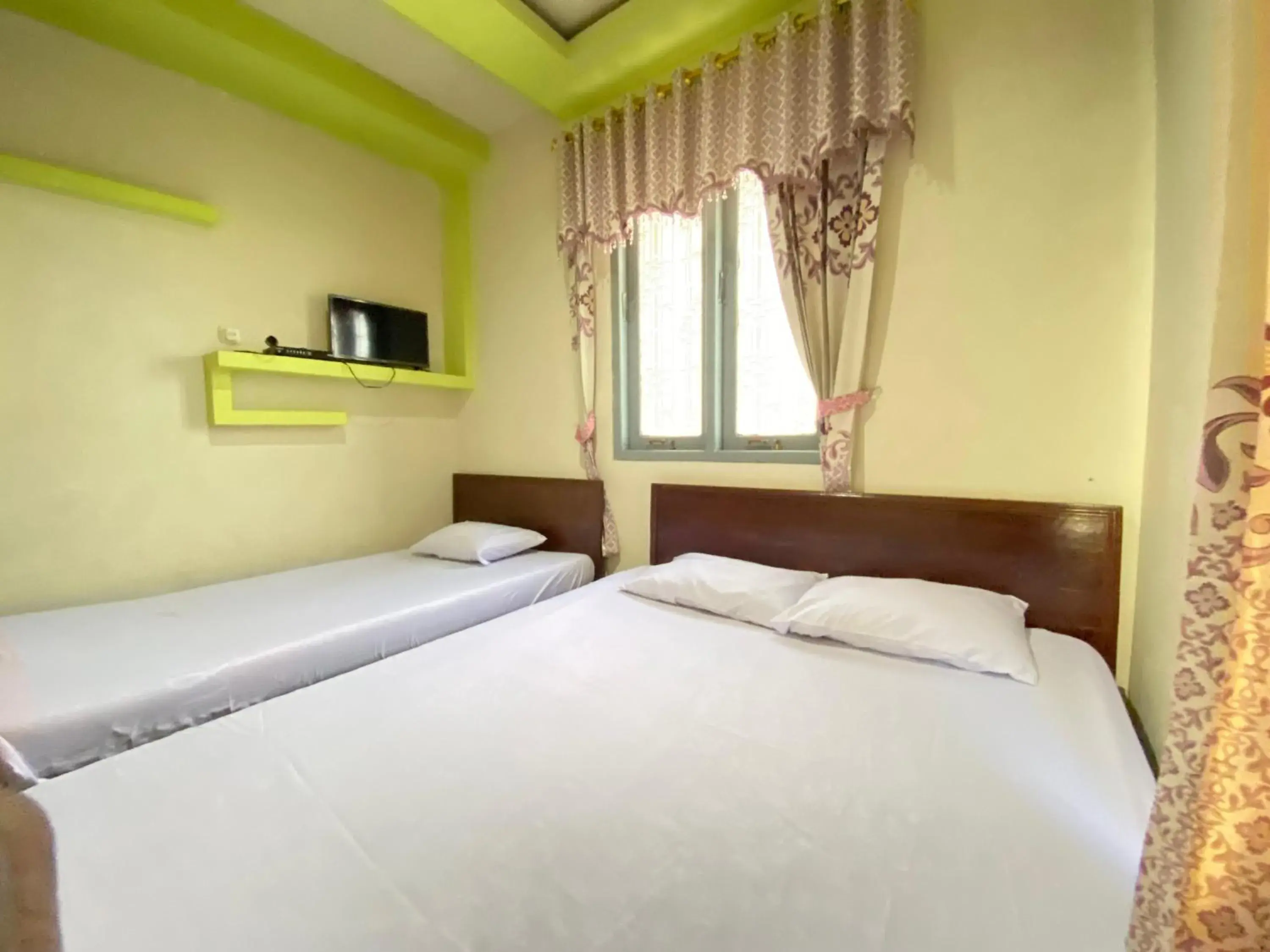 Bed in Homestay Srikandi Syariah Dieng RedPartner Bed in Homestay Srikandi Syariah Dieng RedPartner