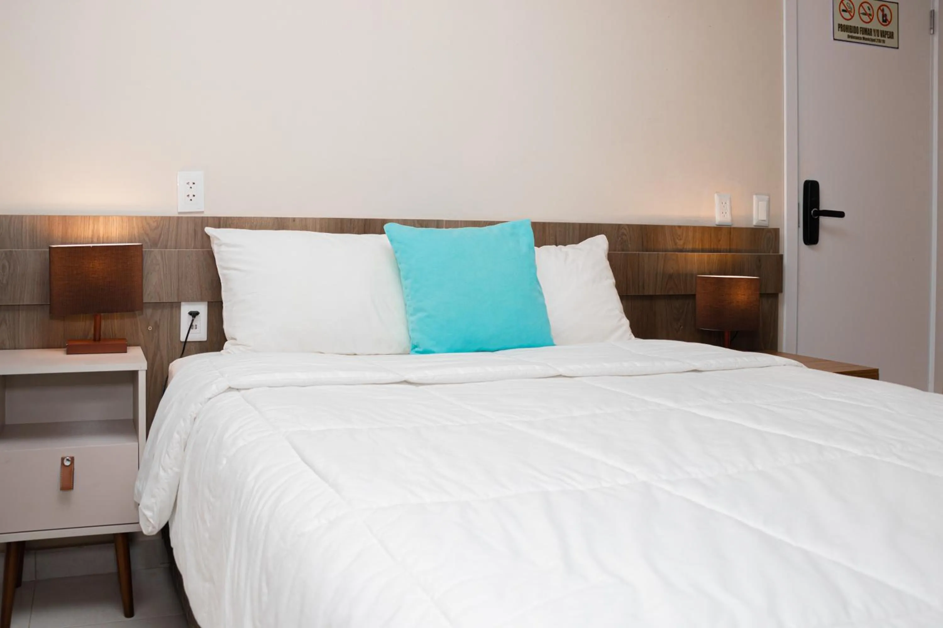 Bed in Faro Norte Suites