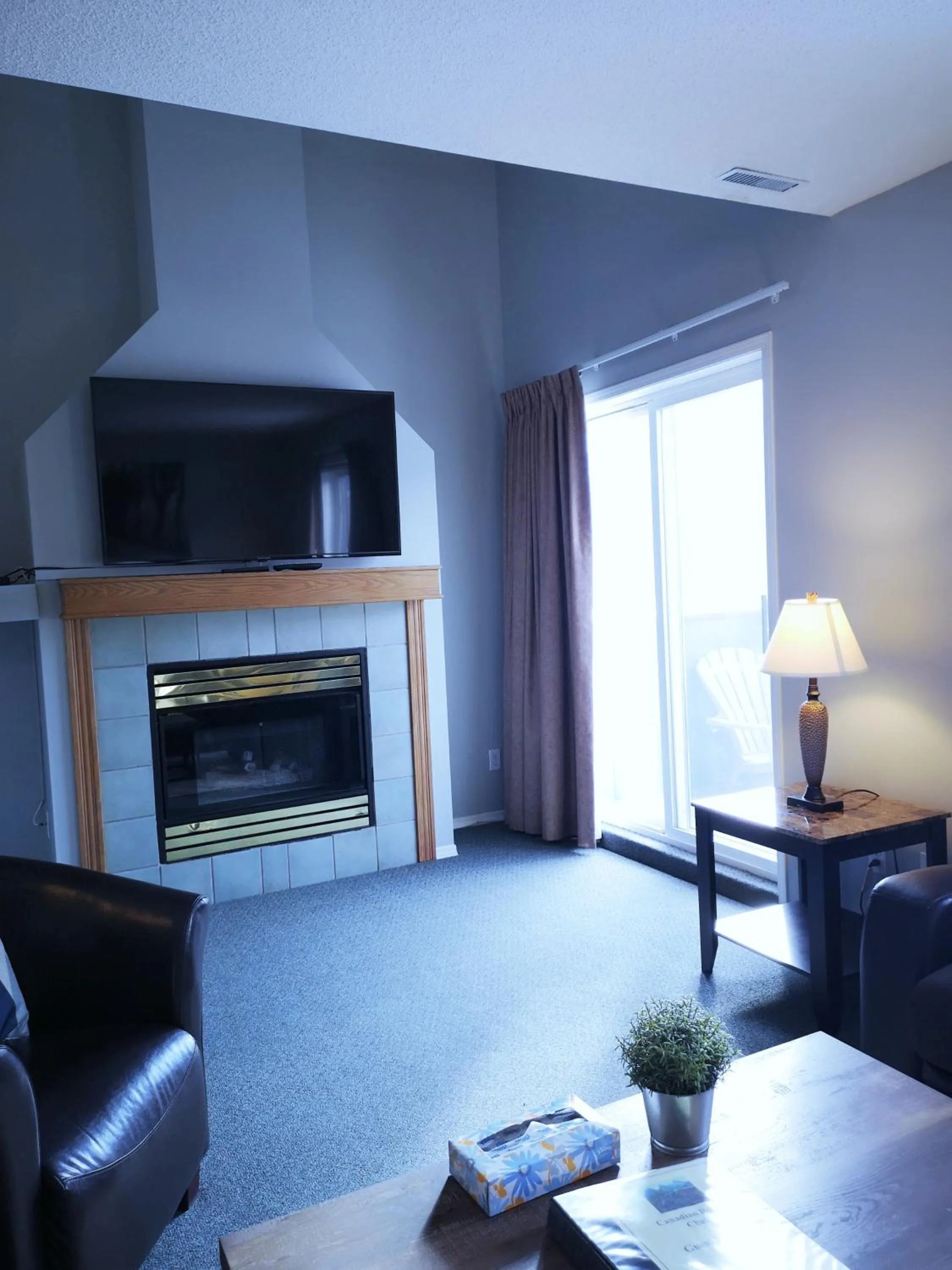 TV and multimedia in Canadian Rockies Chalets by Trilink - 2 & 3 Bedroom Condos - Self Check-In - Walking Distance to Downtown - Free Parking - Pet-Friendly - No AC