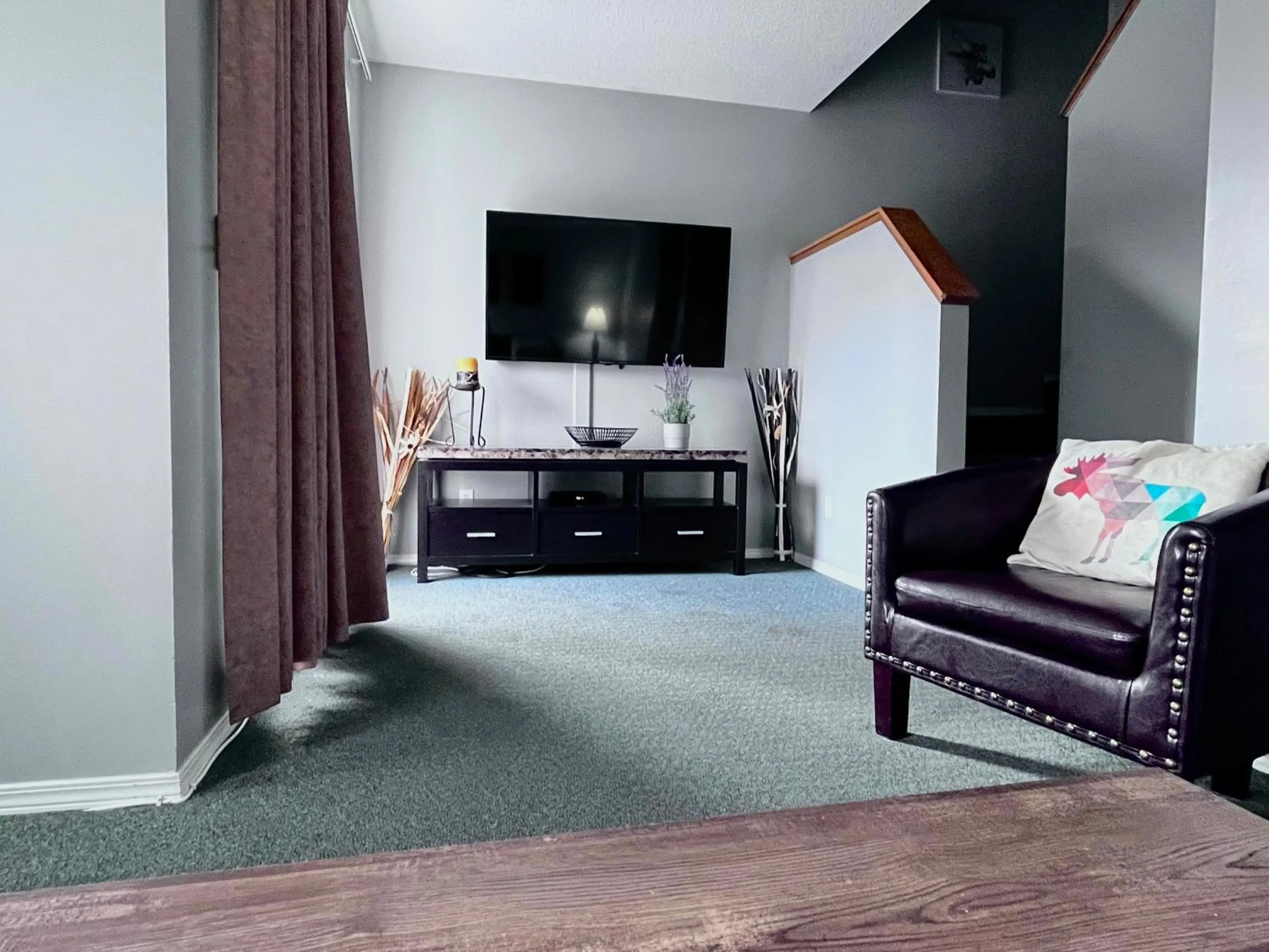 TV and multimedia in Canadian Rockies Chalets by Trilink - 2 & 3 Bedroom Condos - Self Check-In - Walking Distance to Downtown - Free Parking - Pet-Friendly - No AC
