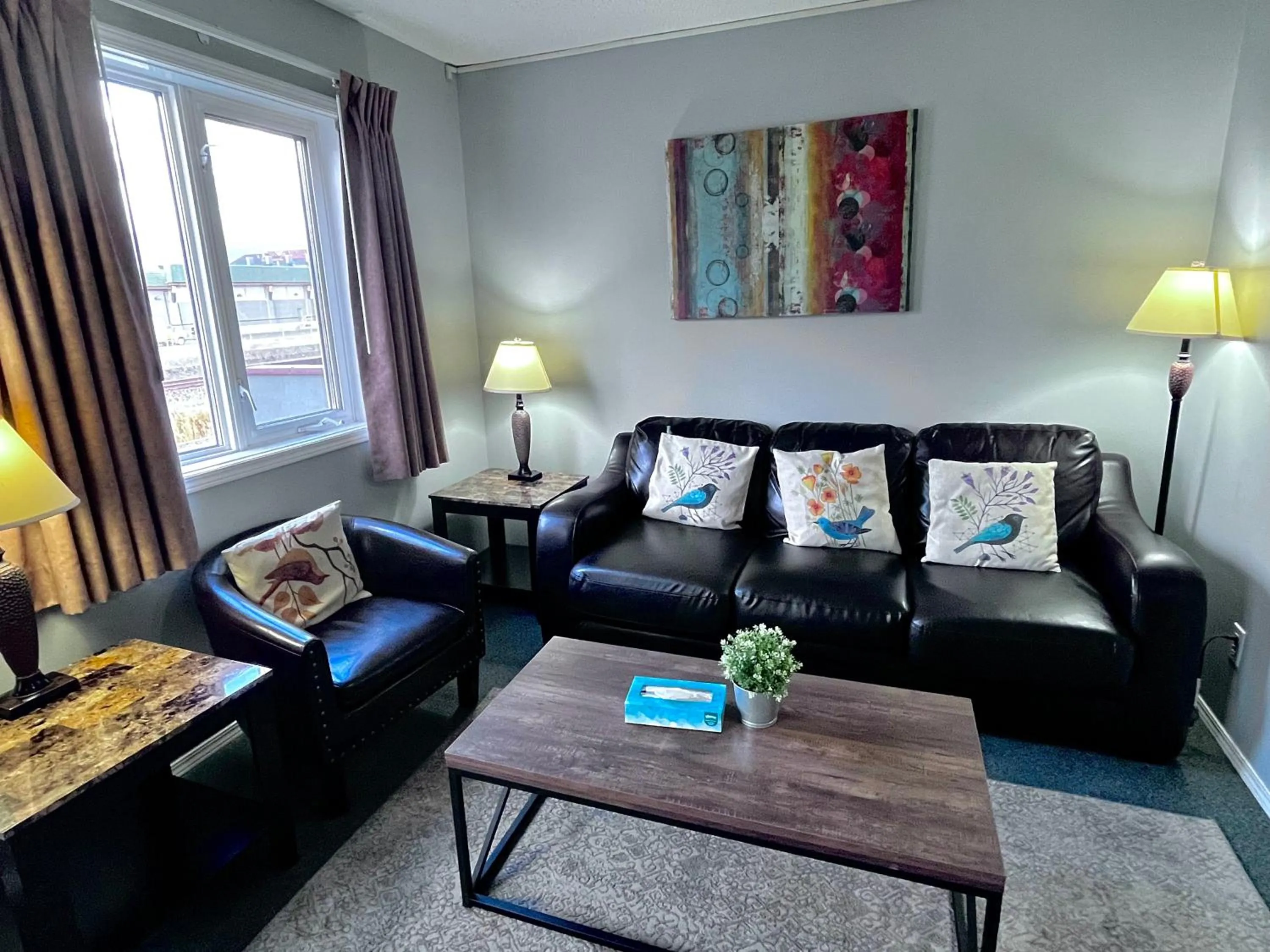 Living room in Canadian Rockies Chalets by Trilink - 2 & 3 Bedroom Condos - Self Check-In - Walking Distance to Downtown - Free Parking - Pet-Friendly - No AC