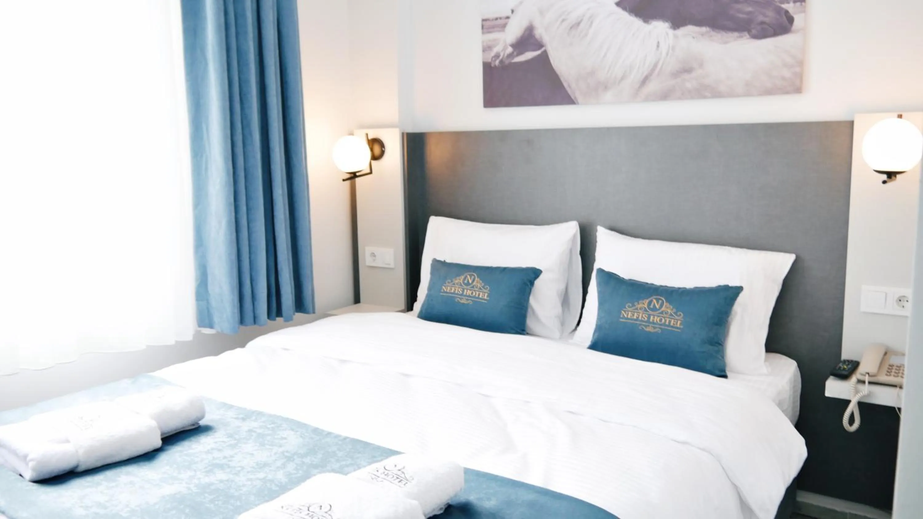 Bed in Nefis Hotel City