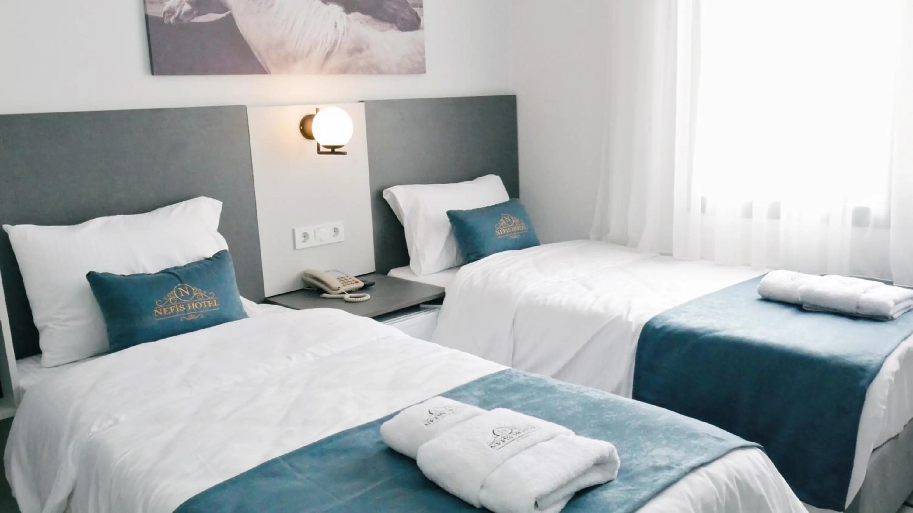 Bed in Nefis Hotel City