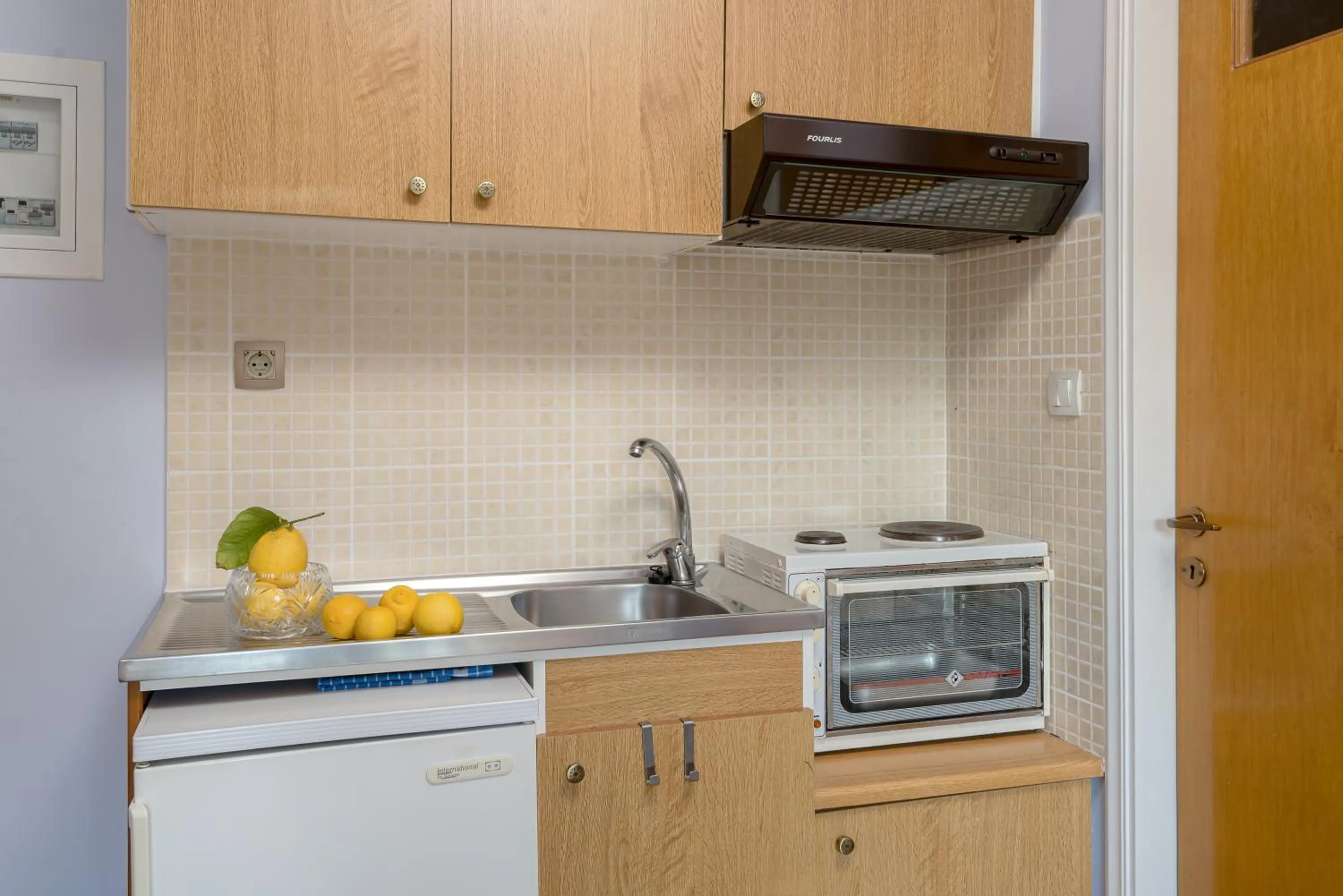 Kitchen or kitchenette in Oasis Apartments