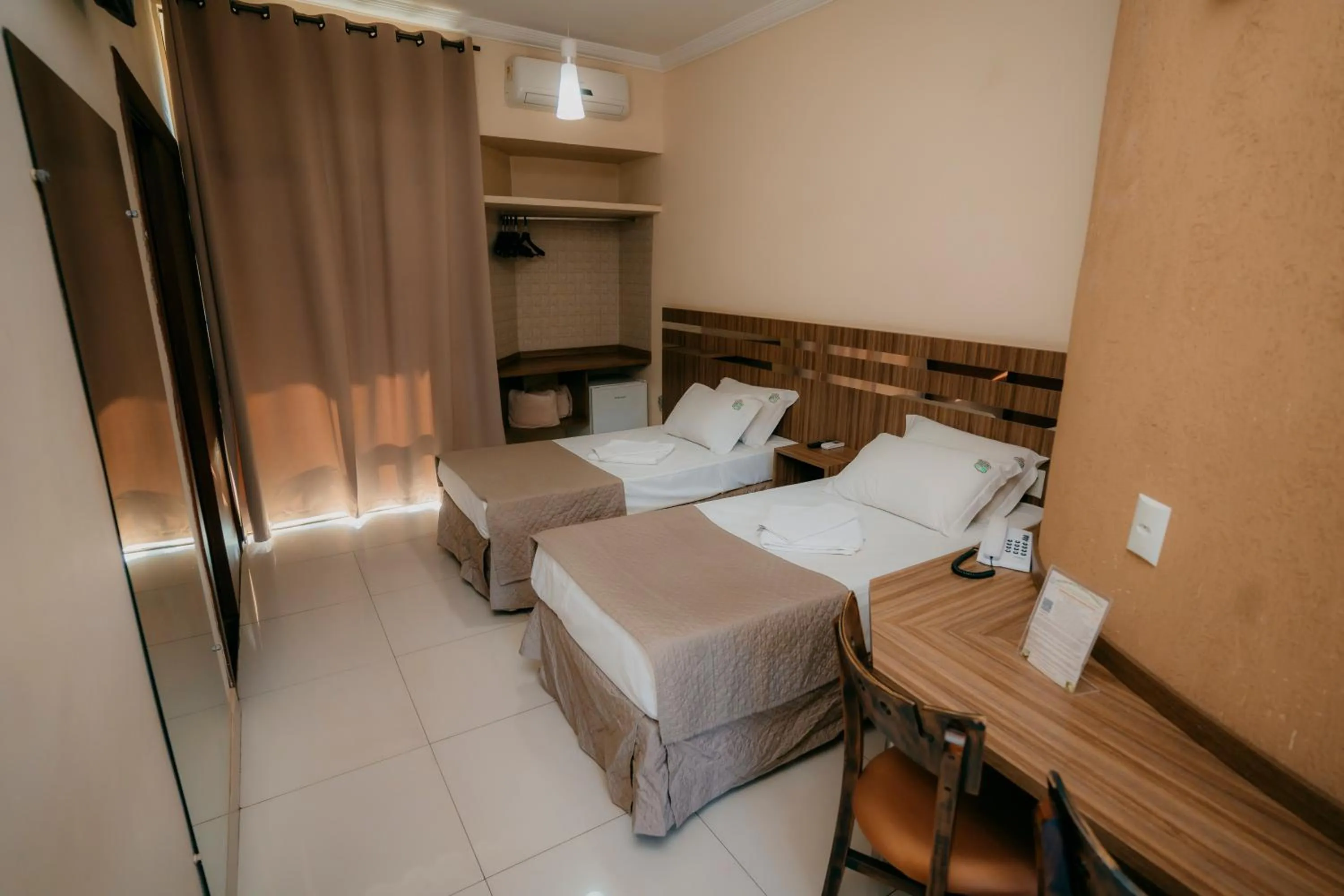 Bed in Estrada Real Palace Hotel