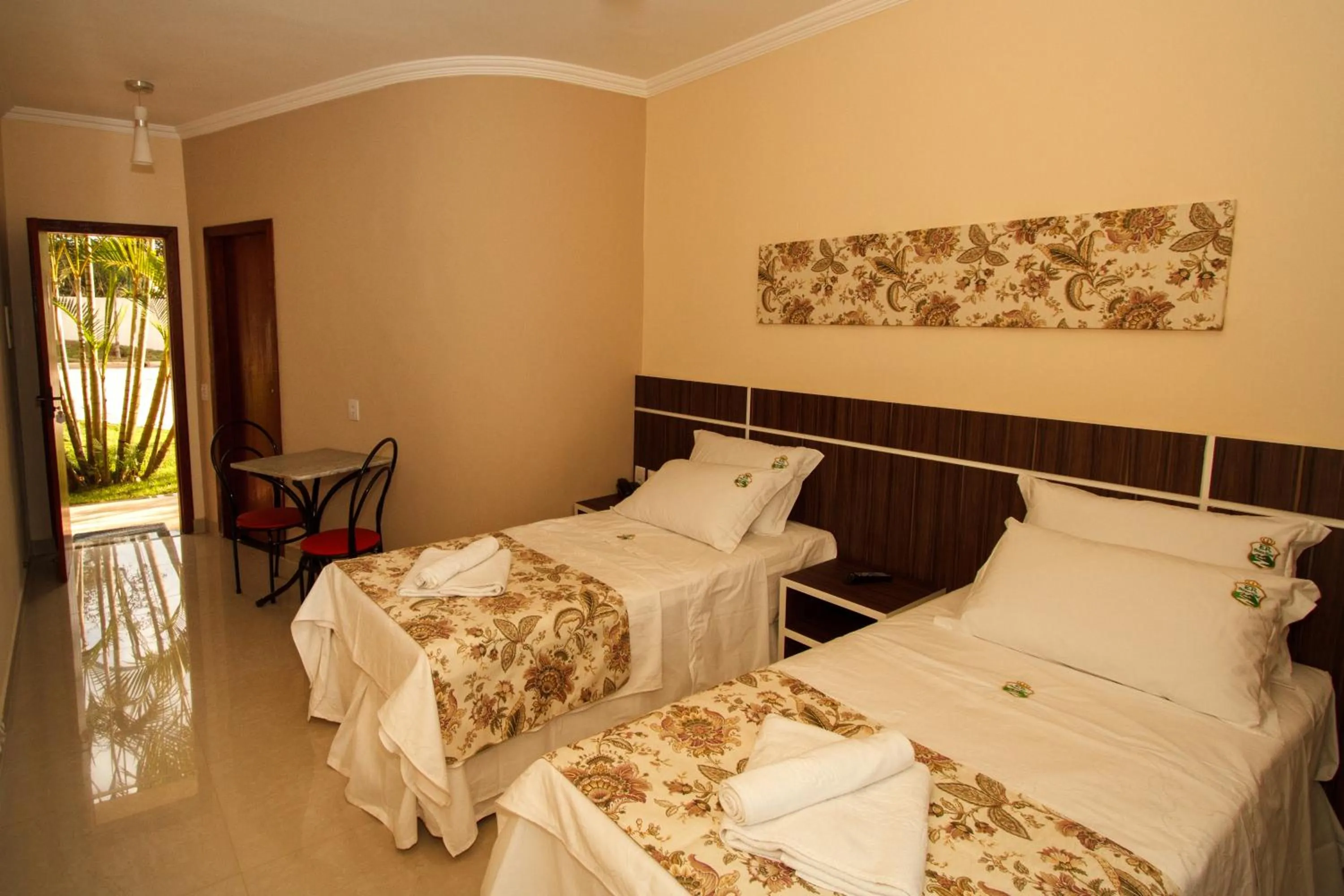 Bed in Estrada Real Palace Hotel