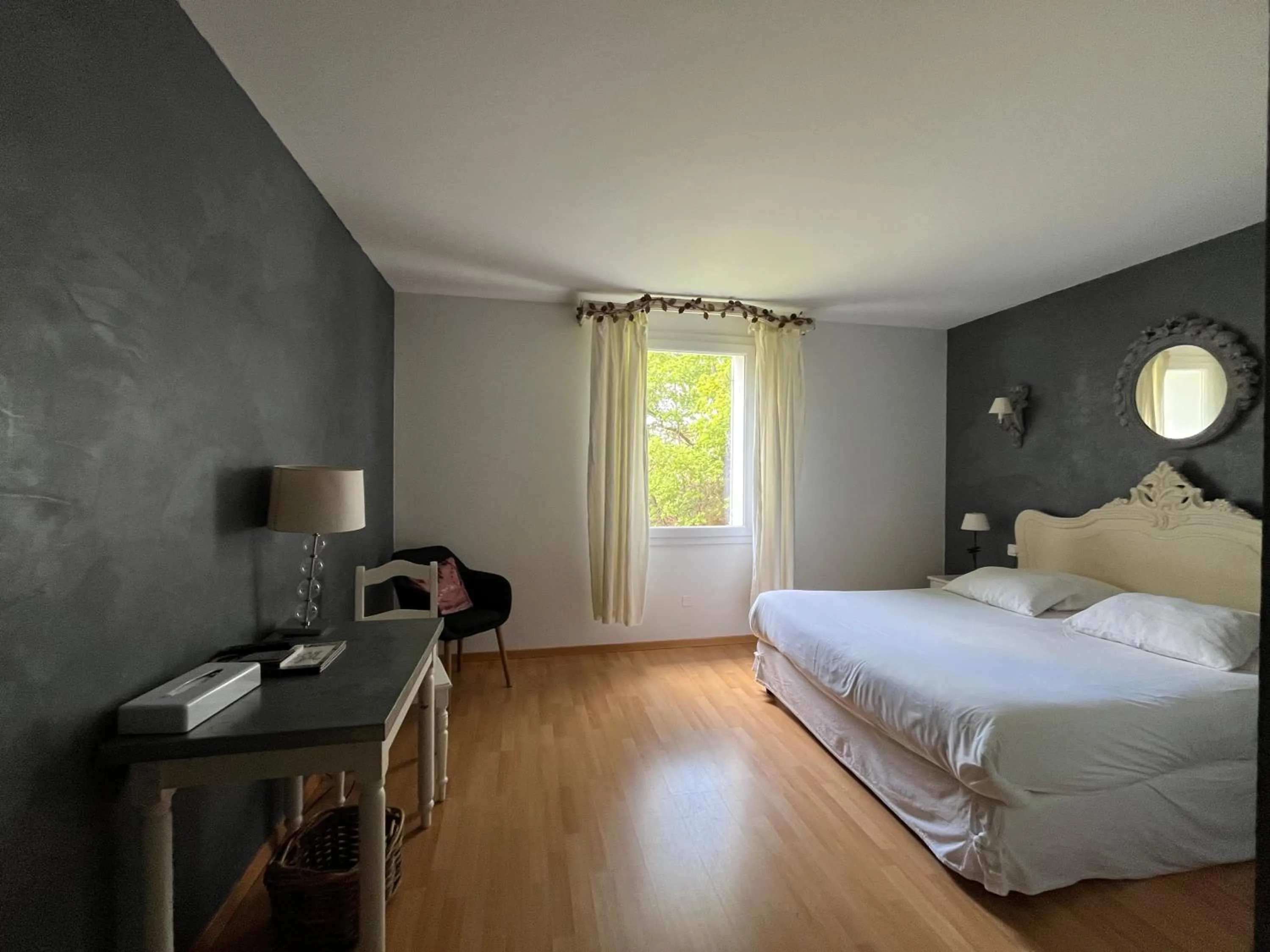 Bed in Logis Hôtel restaurant des Pins