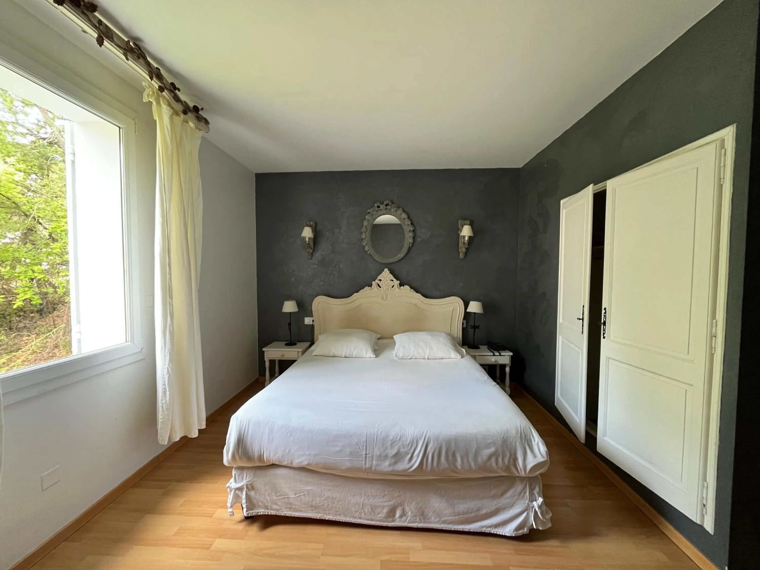 Bed in Logis Hôtel restaurant des Pins