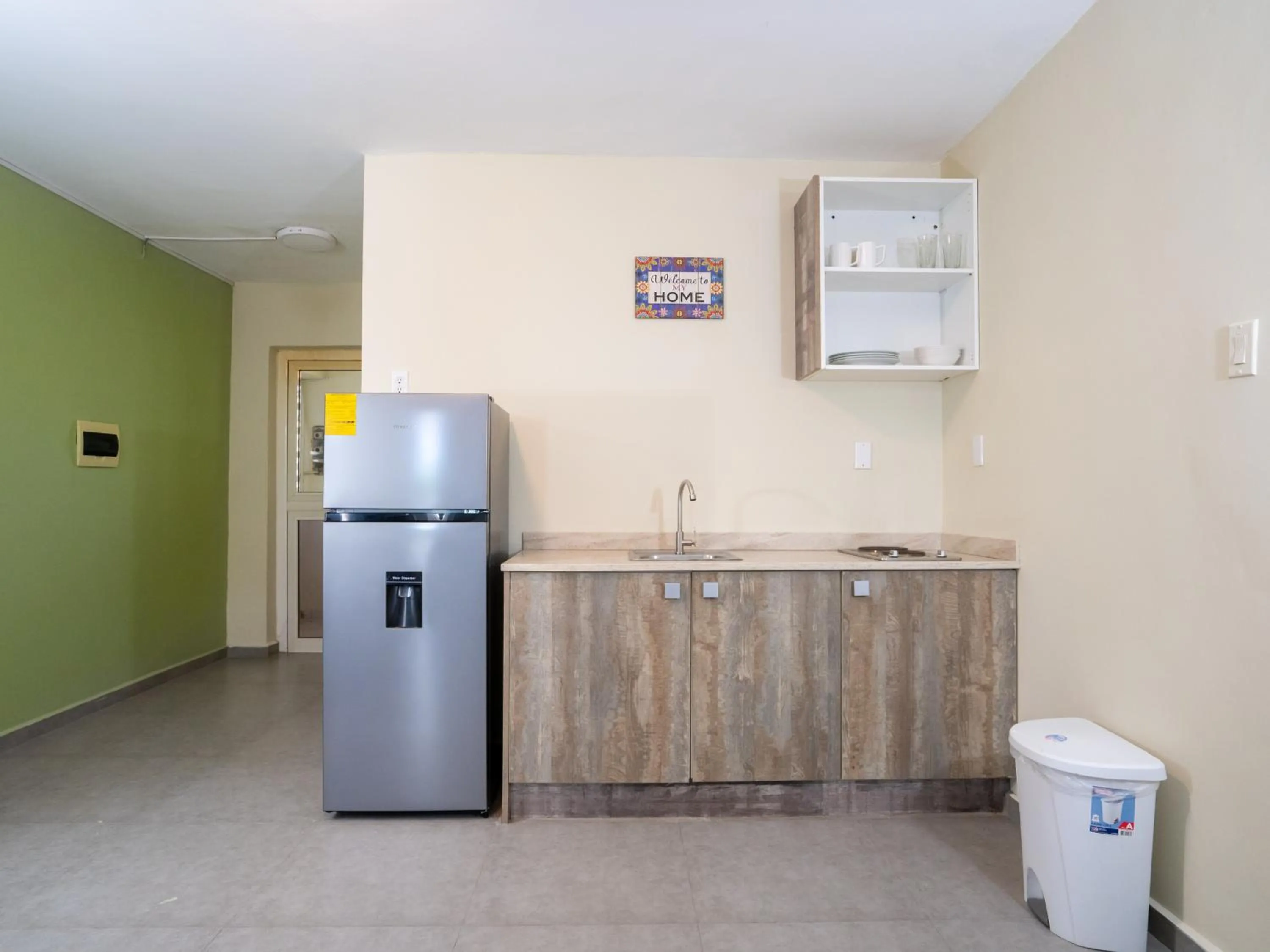 Kitchen or kitchenette in Delynne Boutique Hotel