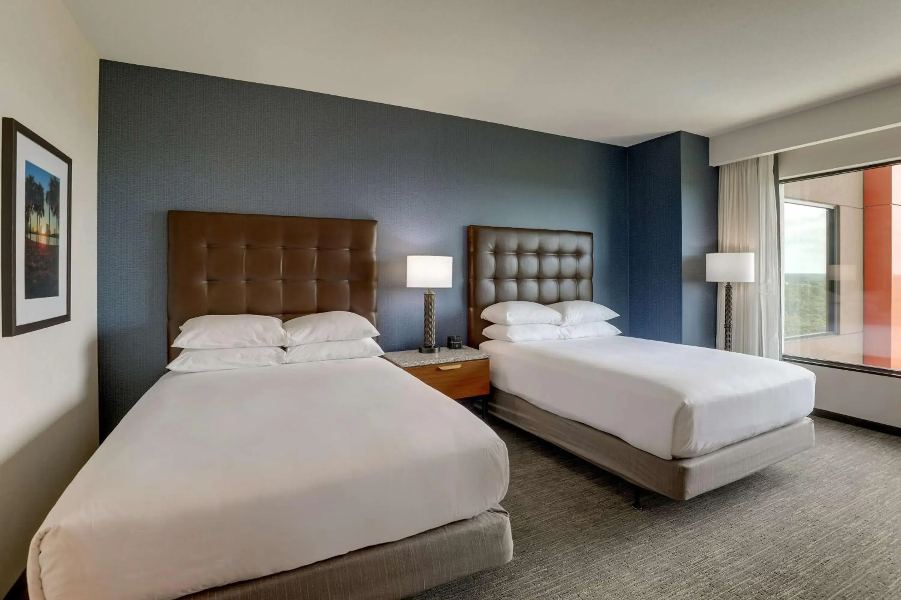 Deluxe Queen Room with Two Queen Beds - Hearing Accessible, Nightly views of area fireworks in Drury Plaza Hotel Orlando - Disney Springs Area Deluxe Queen Room with Two Queen Beds - Hearing Accessible, Nightly views of area fireworks in Drury Plaza Hotel Orlando - Disney Springs Area