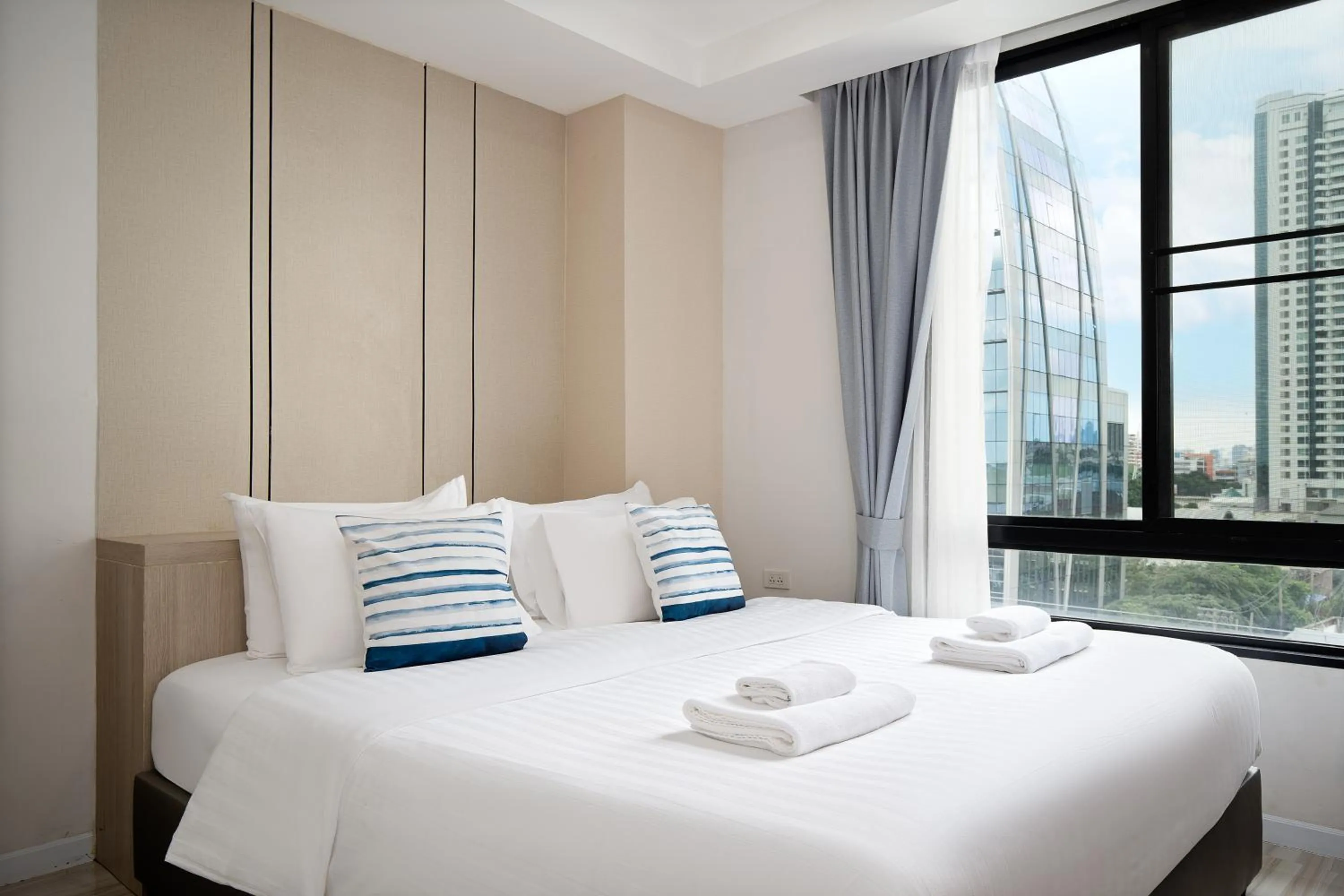 Bed in The Riski Hotel at Bangphlat Station SHA