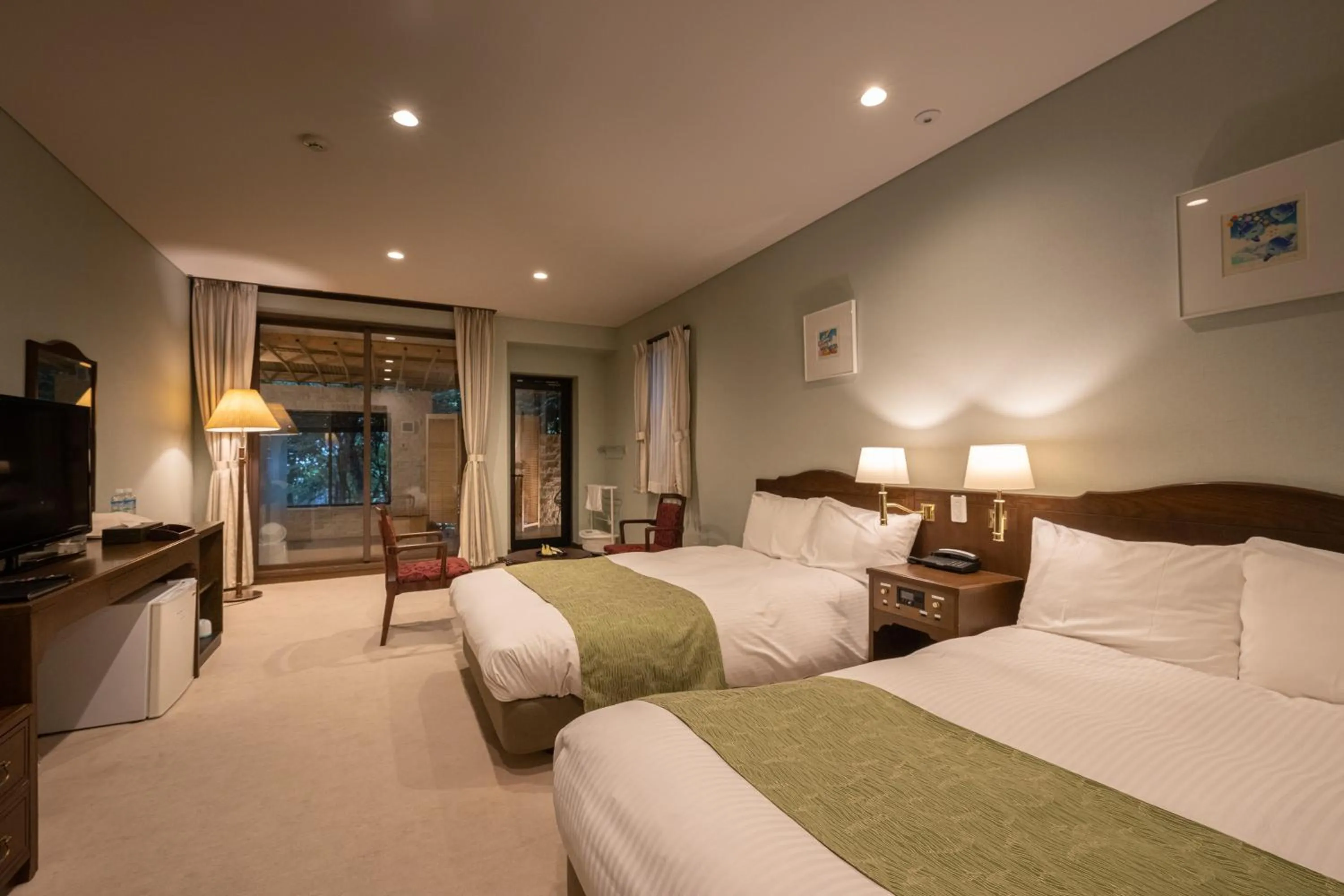 Bed in 伊豆高原温泉ホテル 森の泉