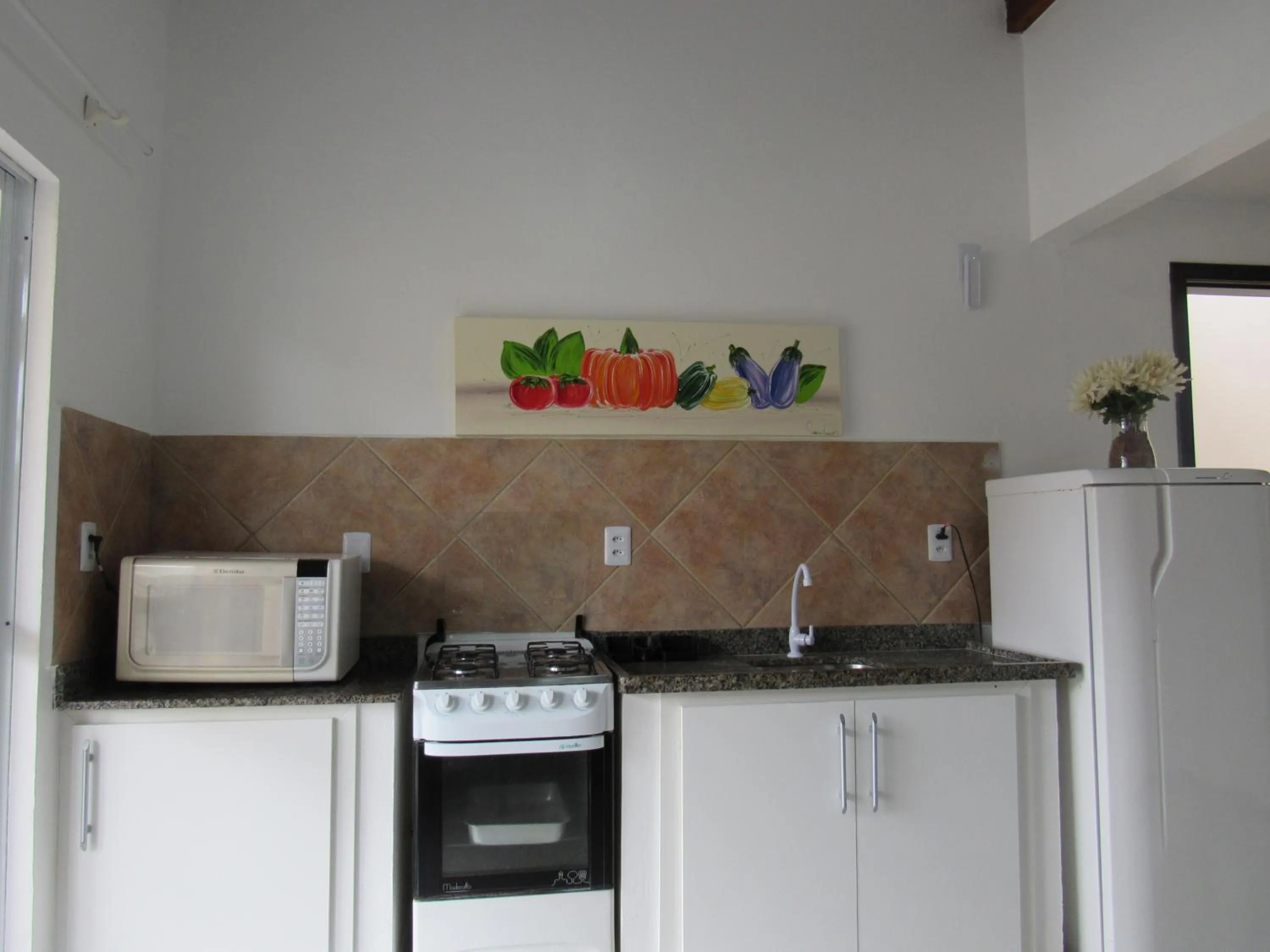 Kitchen or kitchenette in Pousada Vila do Navegante