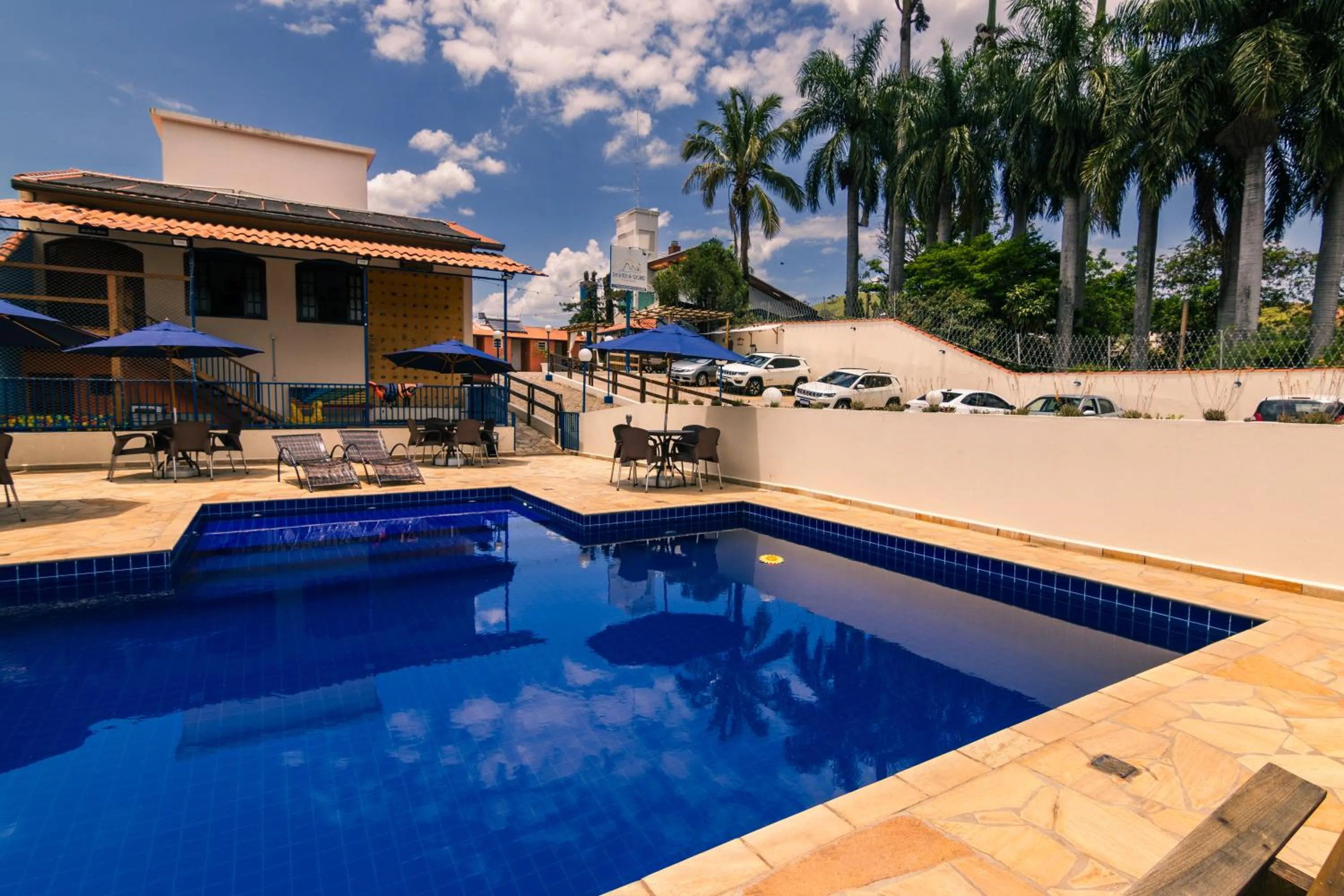 Swimming pool in Pousada Encantos de Socorro