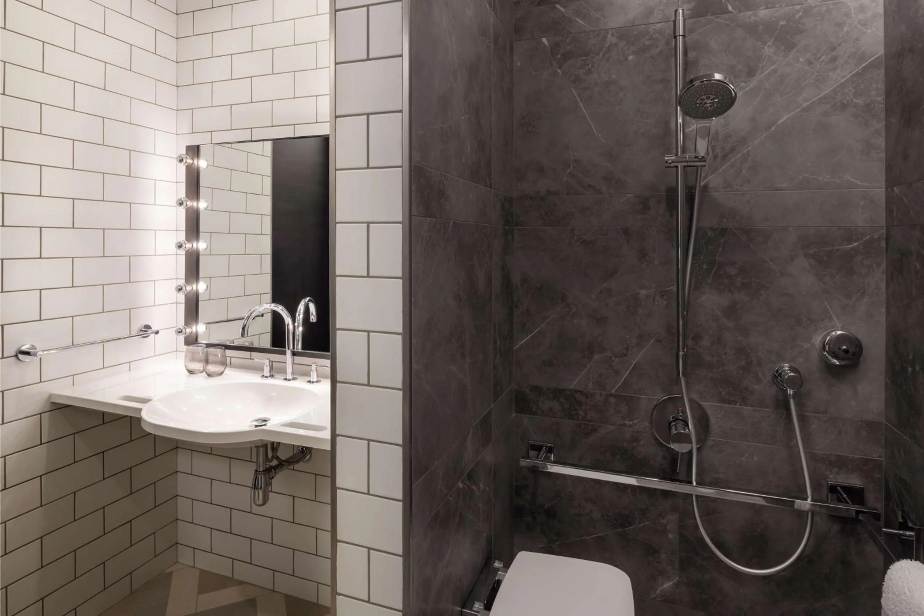 Toilet in The WB Abu Dhabi, Curio Collection By Hilton