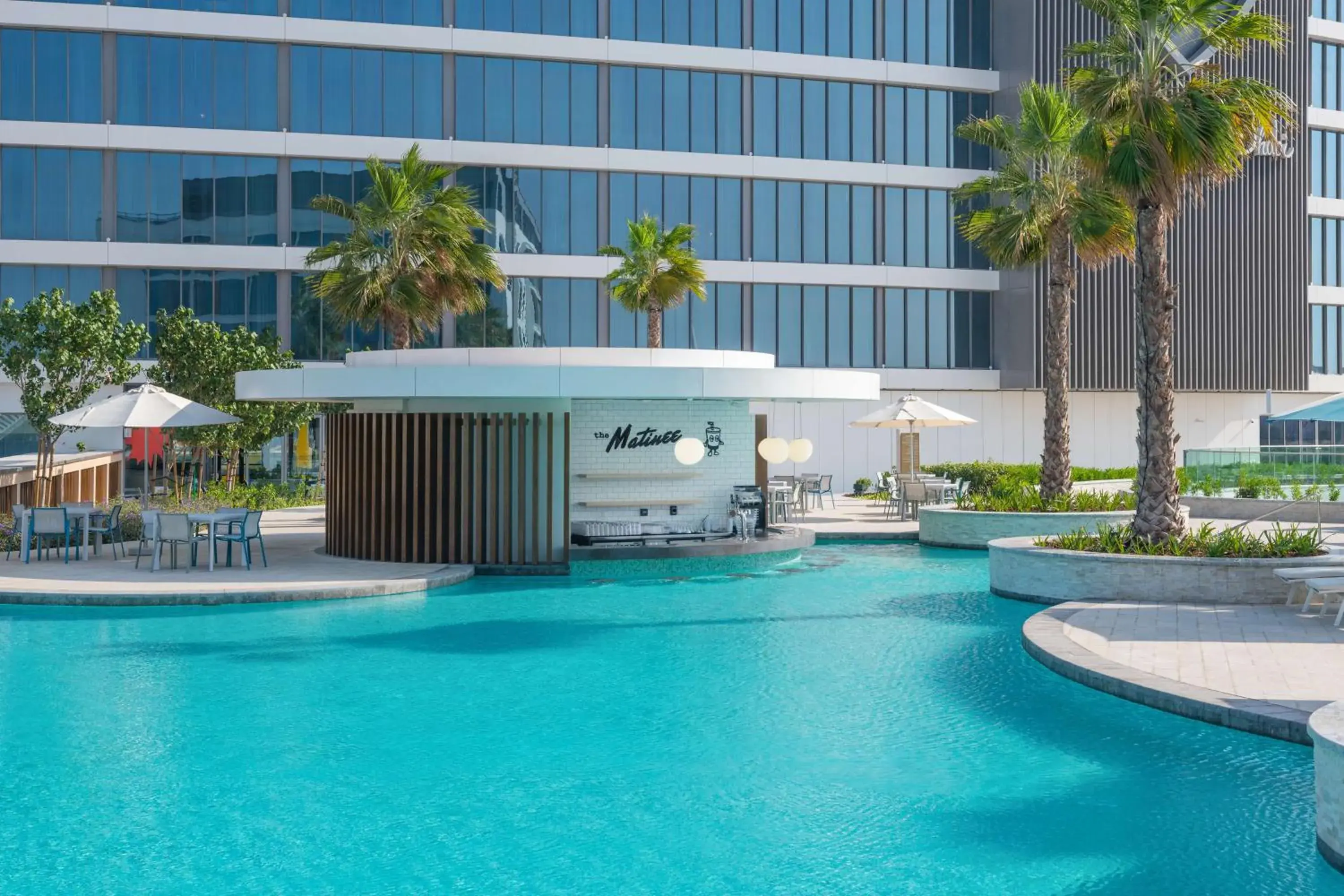 Pool view in The WB Abu Dhabi, Curio Collection By Hilton Pool view in The WB Abu Dhabi, Curio Collection By Hilton