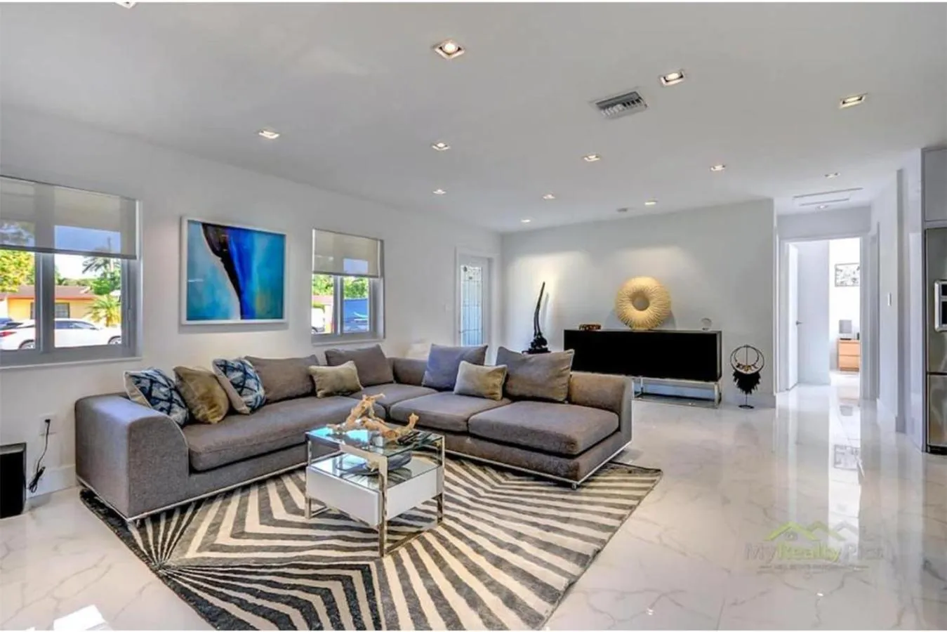 Communal lounge/ TV room in Magical Miami Retreat with Heated Pool, Mini Golf, and Basketball Court L19