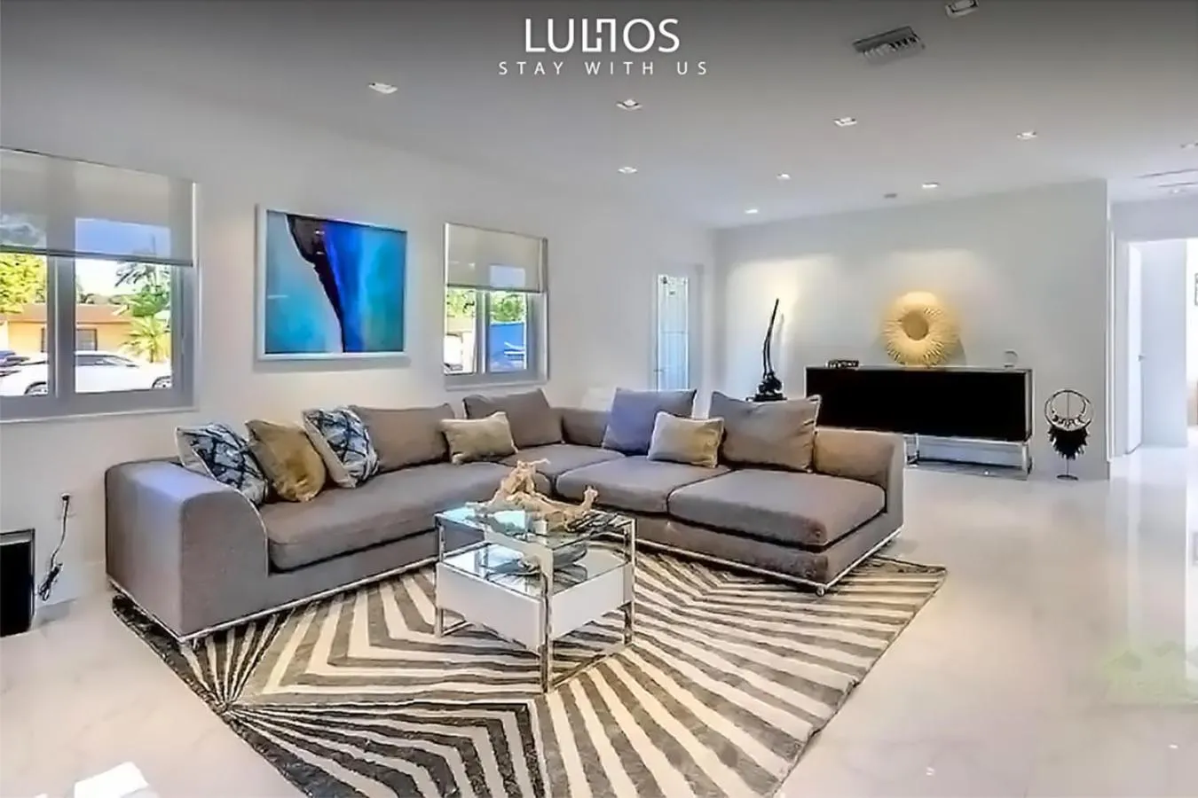 Communal lounge/ TV room in Magical Miami Retreat with Heated Pool, Mini Golf, and Basketball Court L19