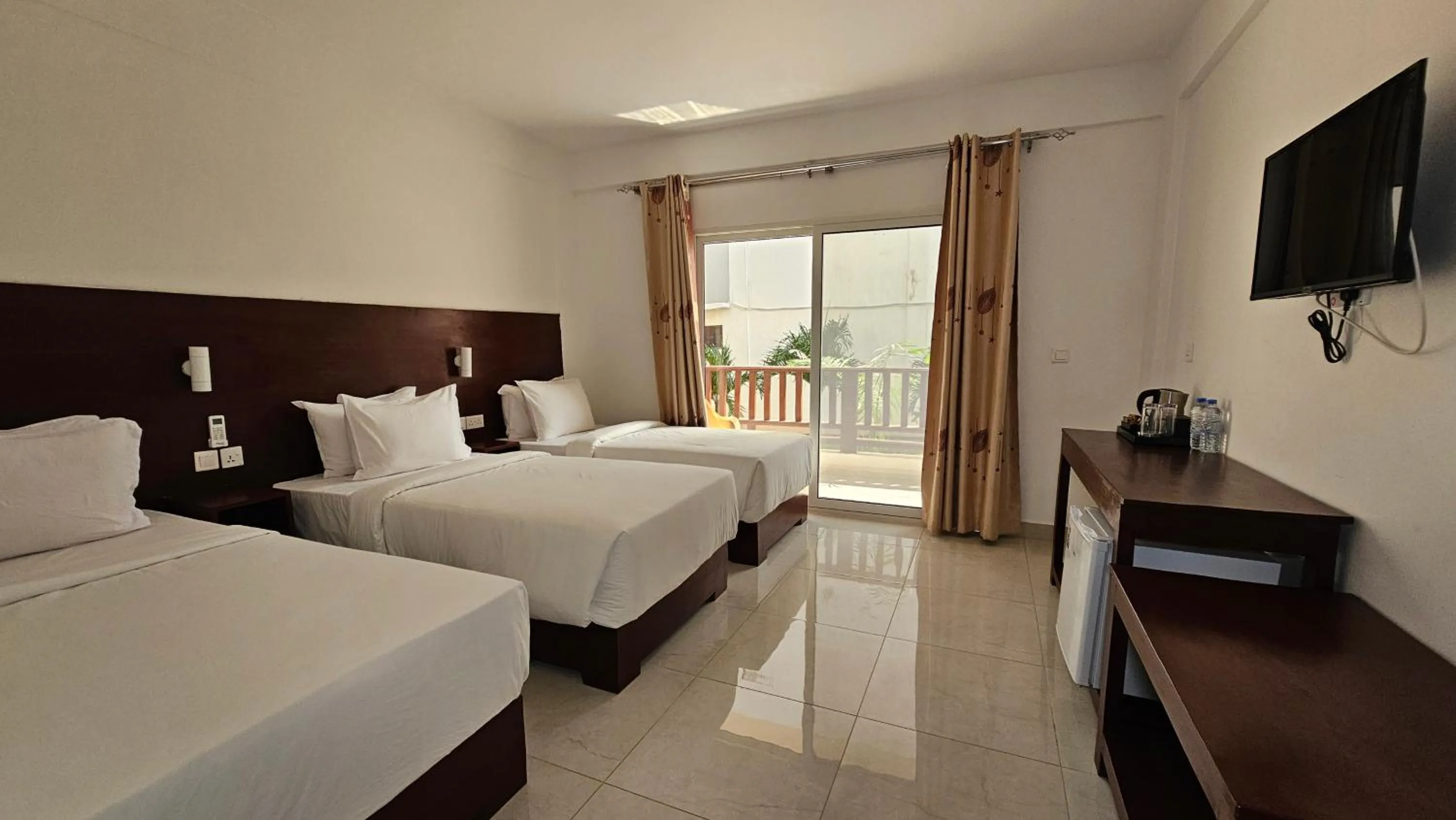 Bed in Malika Nungwi Hotel