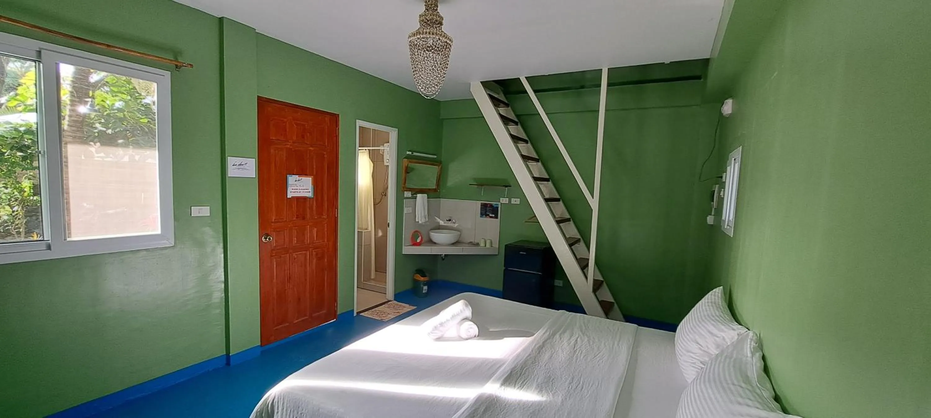 Bed in In Dai Aquasports and Beach Resort