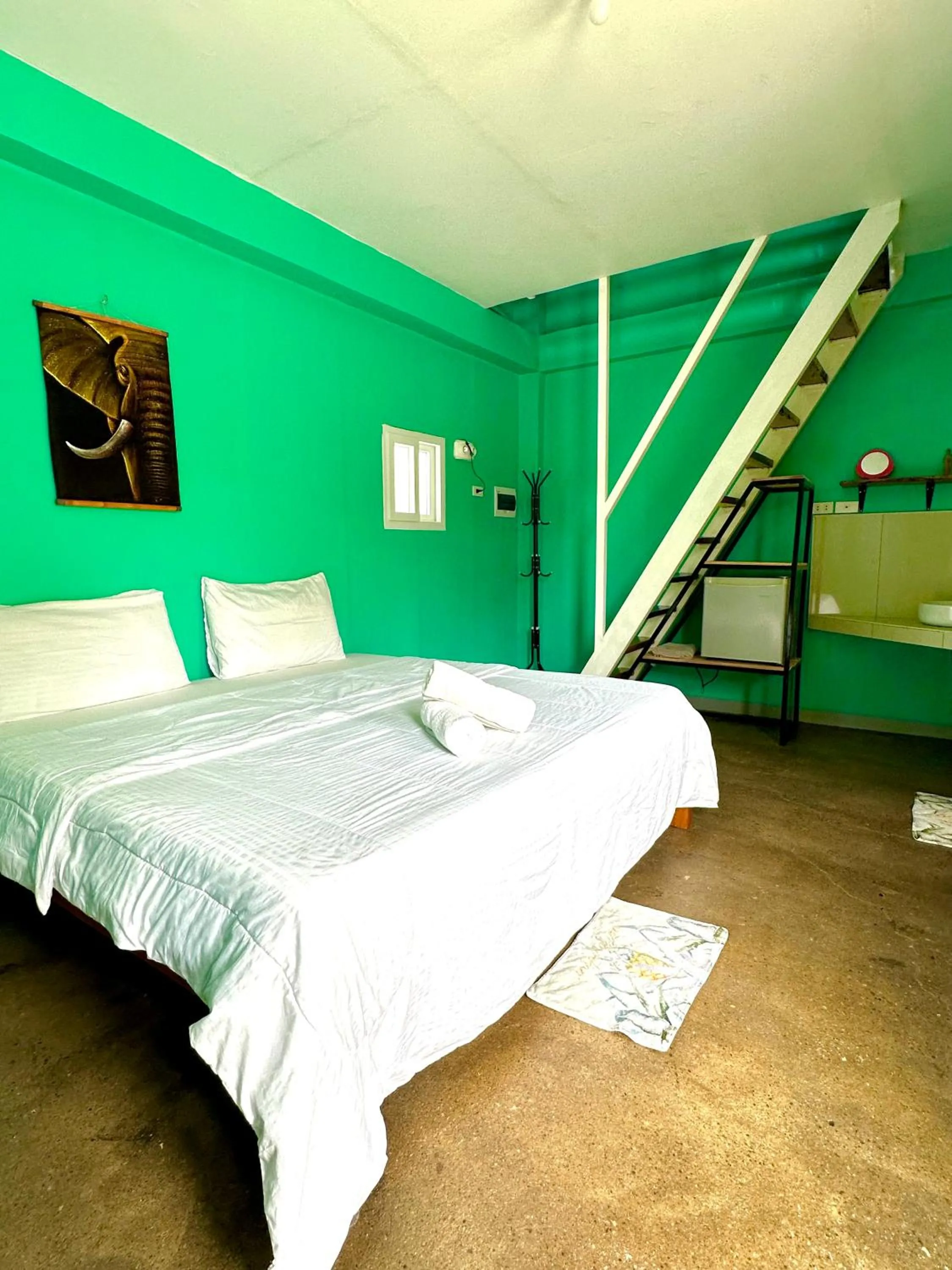 Bed in In Dai Aquasports and Beach Resort