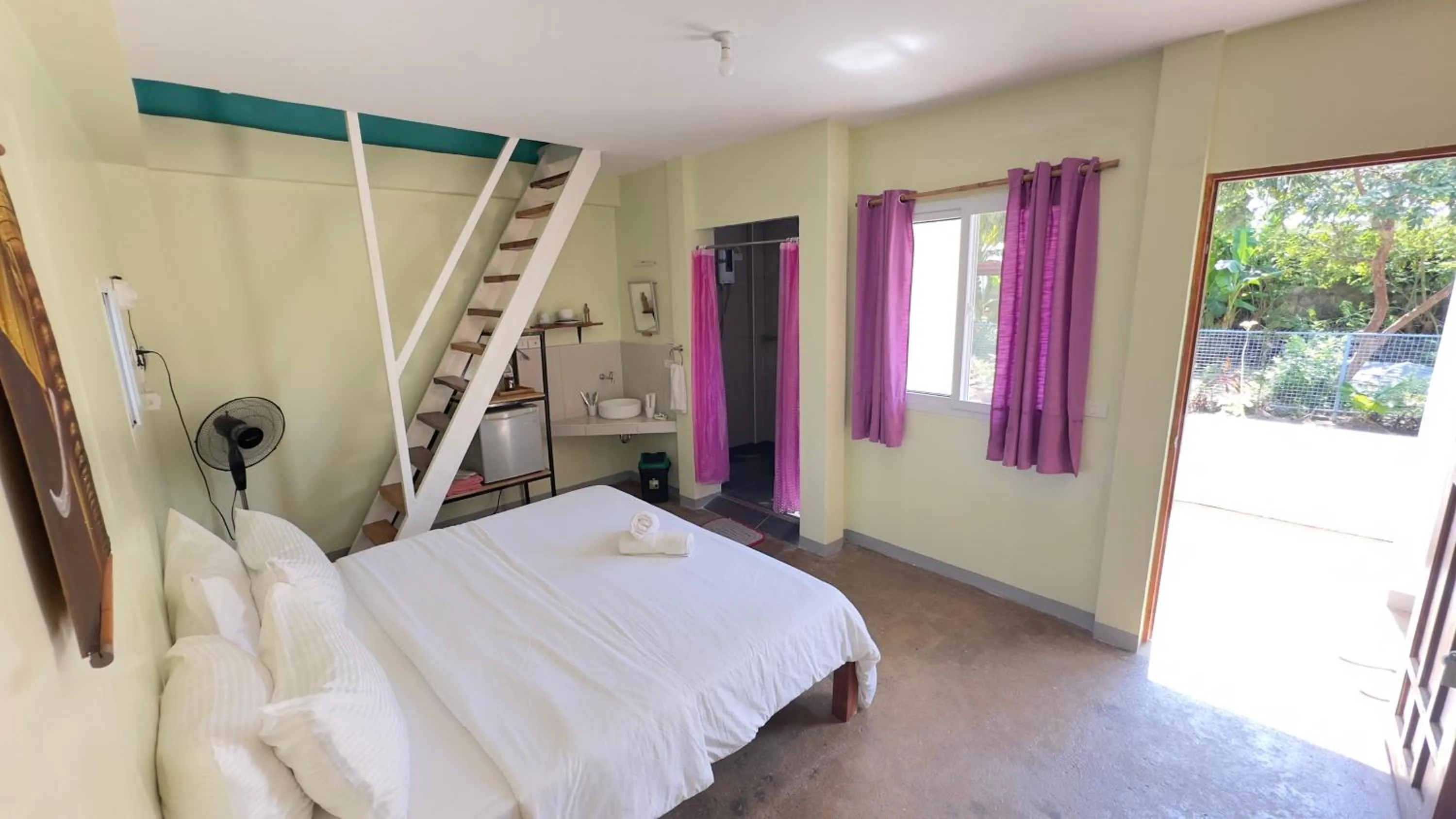 Bed in In Dai Aquasports and Beach Resort