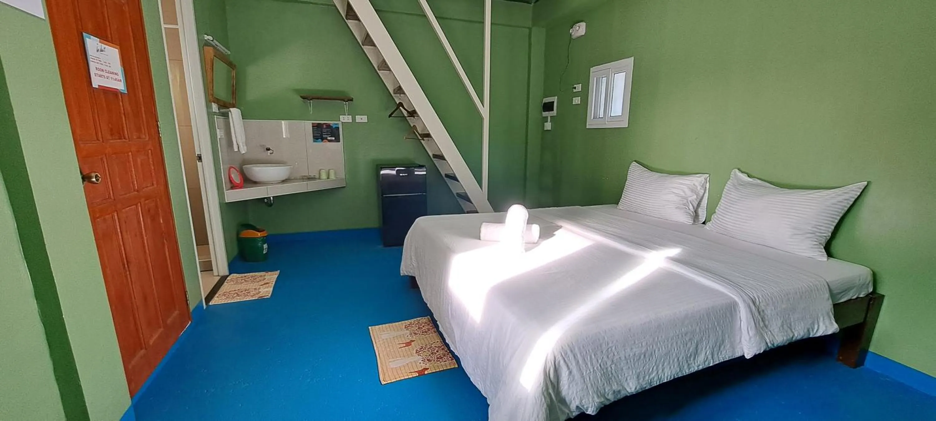 Bed in In Dai Aquasports and Beach Resort