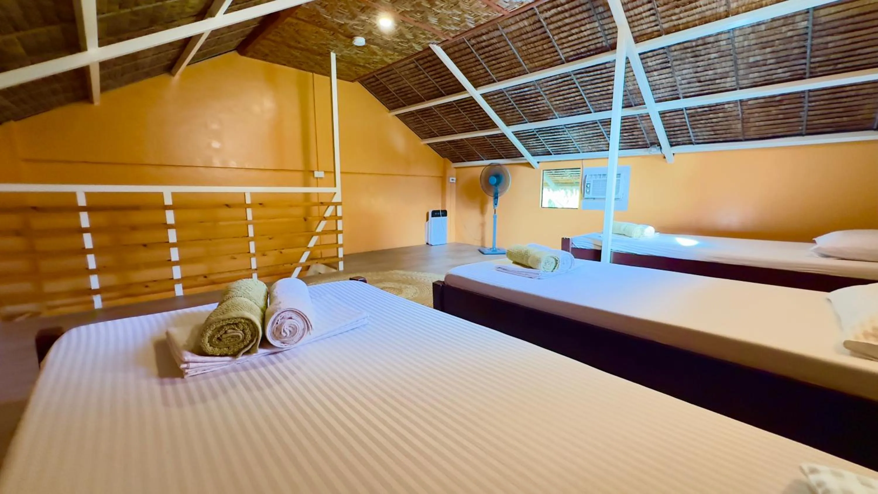 Bed in In Dai Aquasports and Beach Resort