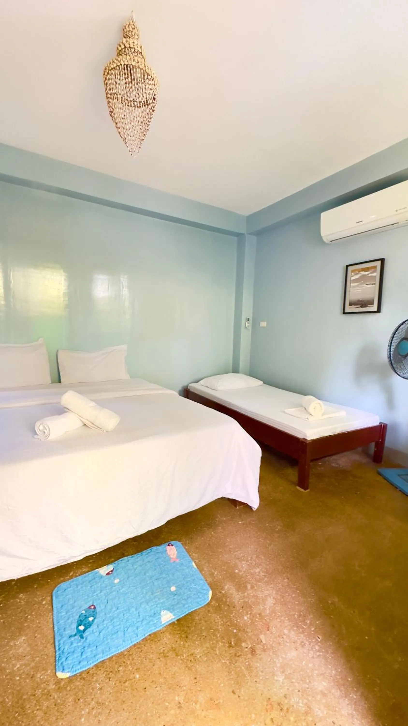 Bed in In Dai Aquasports and Beach Resort