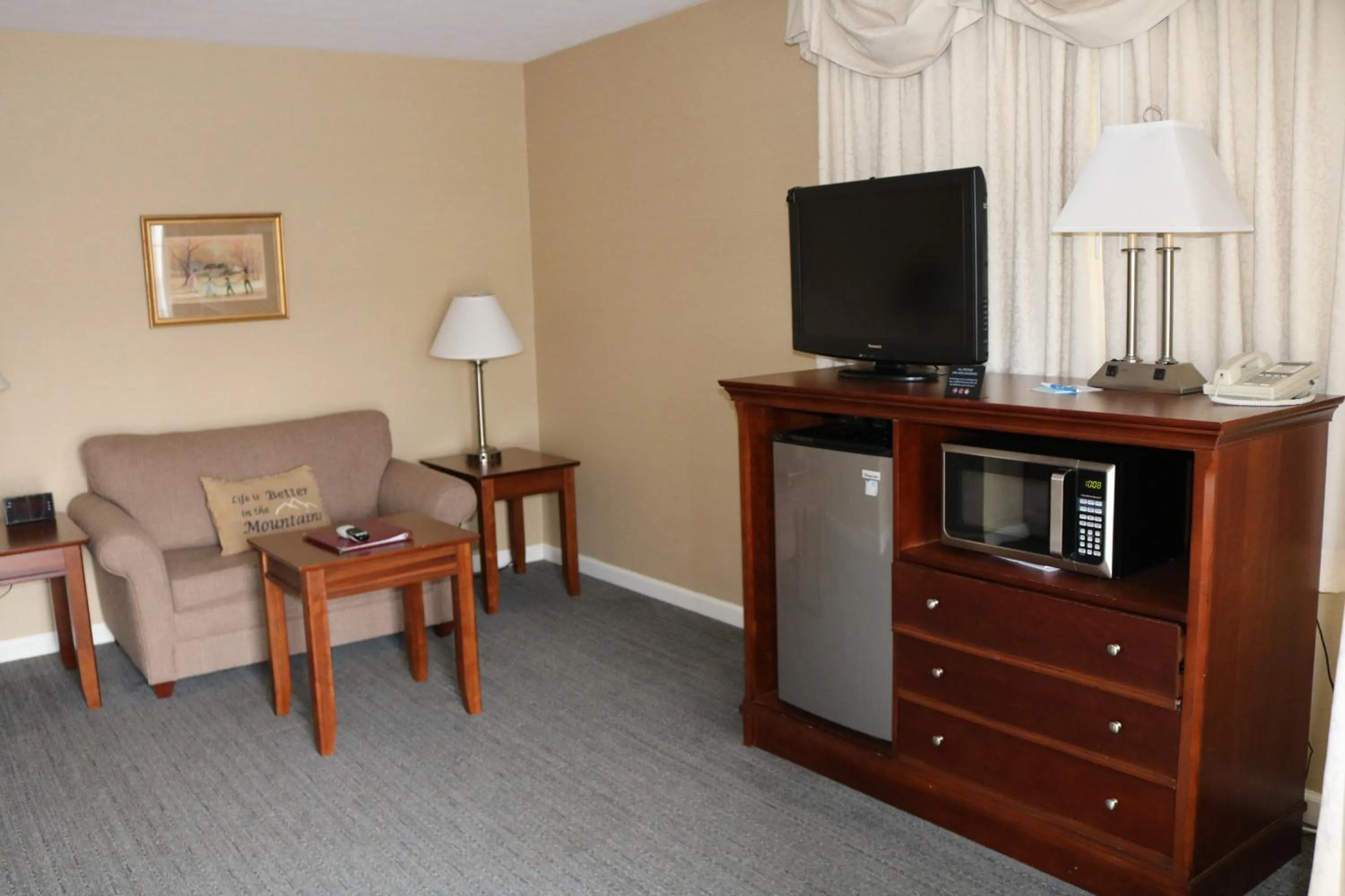 Communal lounge/ TV room in The Village Inn