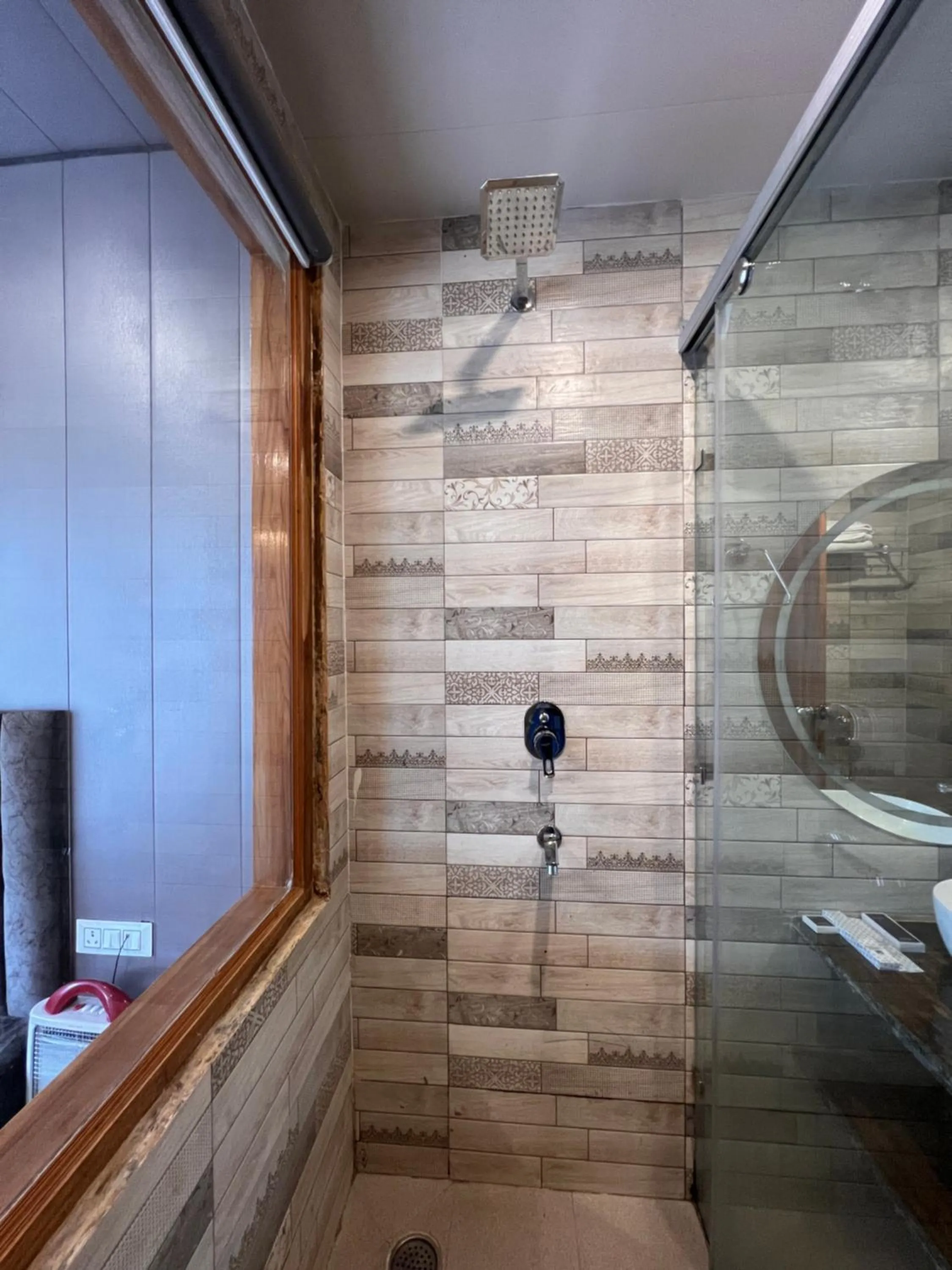 Shower in Yogved Hospitality & Resort